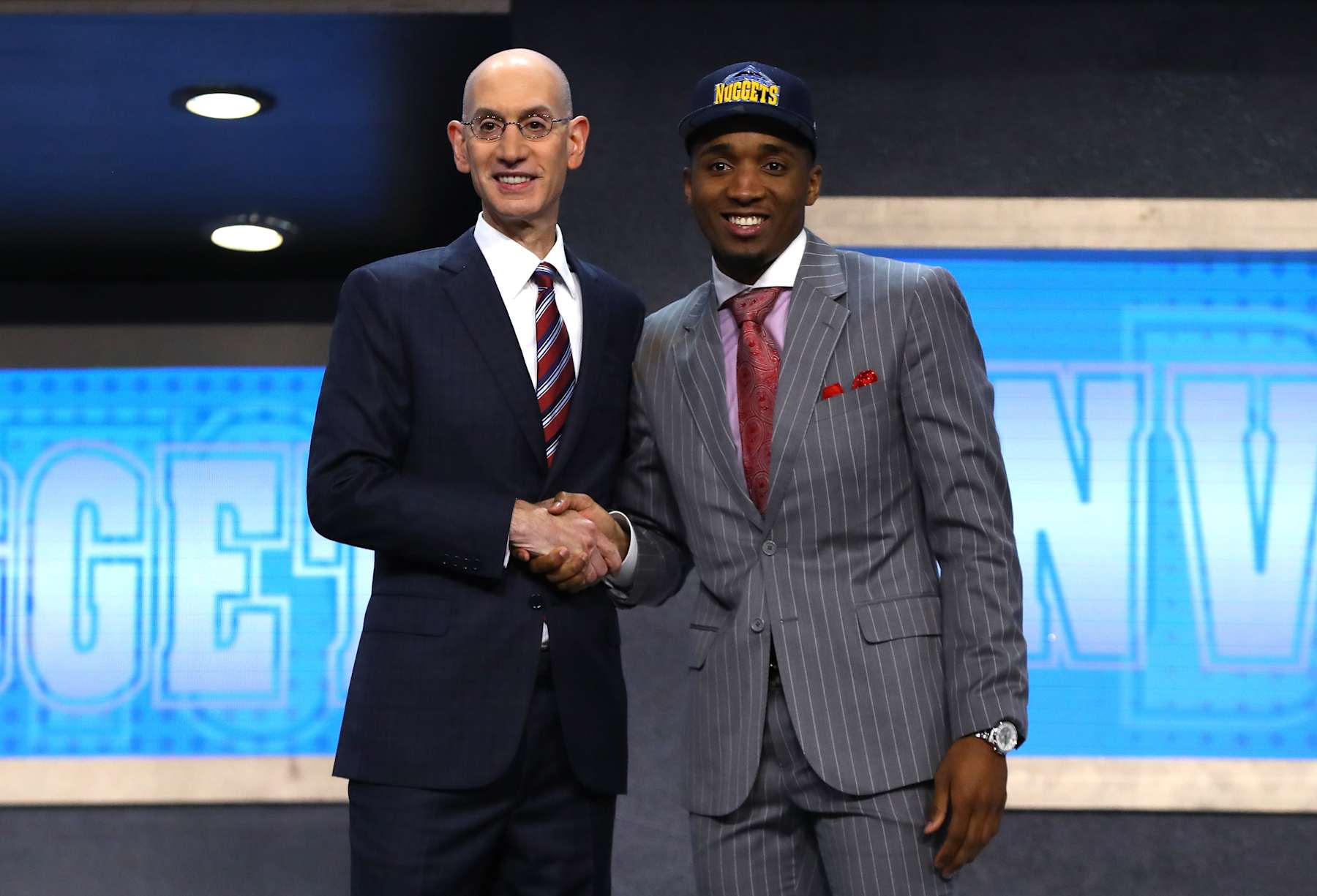 NEW YORK, NY - JUNE 22:  Donovan Mitchell walks on stage with NBA commissioner Adam Silver after being drafted 13th overall by the Denver Nuggets during the first round of the 2017 NBA Draft at Barclays Center on June 22, 2017 in New York City. NOTE TO USER: User expressly acknowledges and agrees that, by downloading and or using this photograph, User is consenting to the terms and conditions of the Getty Images License Agreement.  (Photo by Mike Stobe/Getty Images)