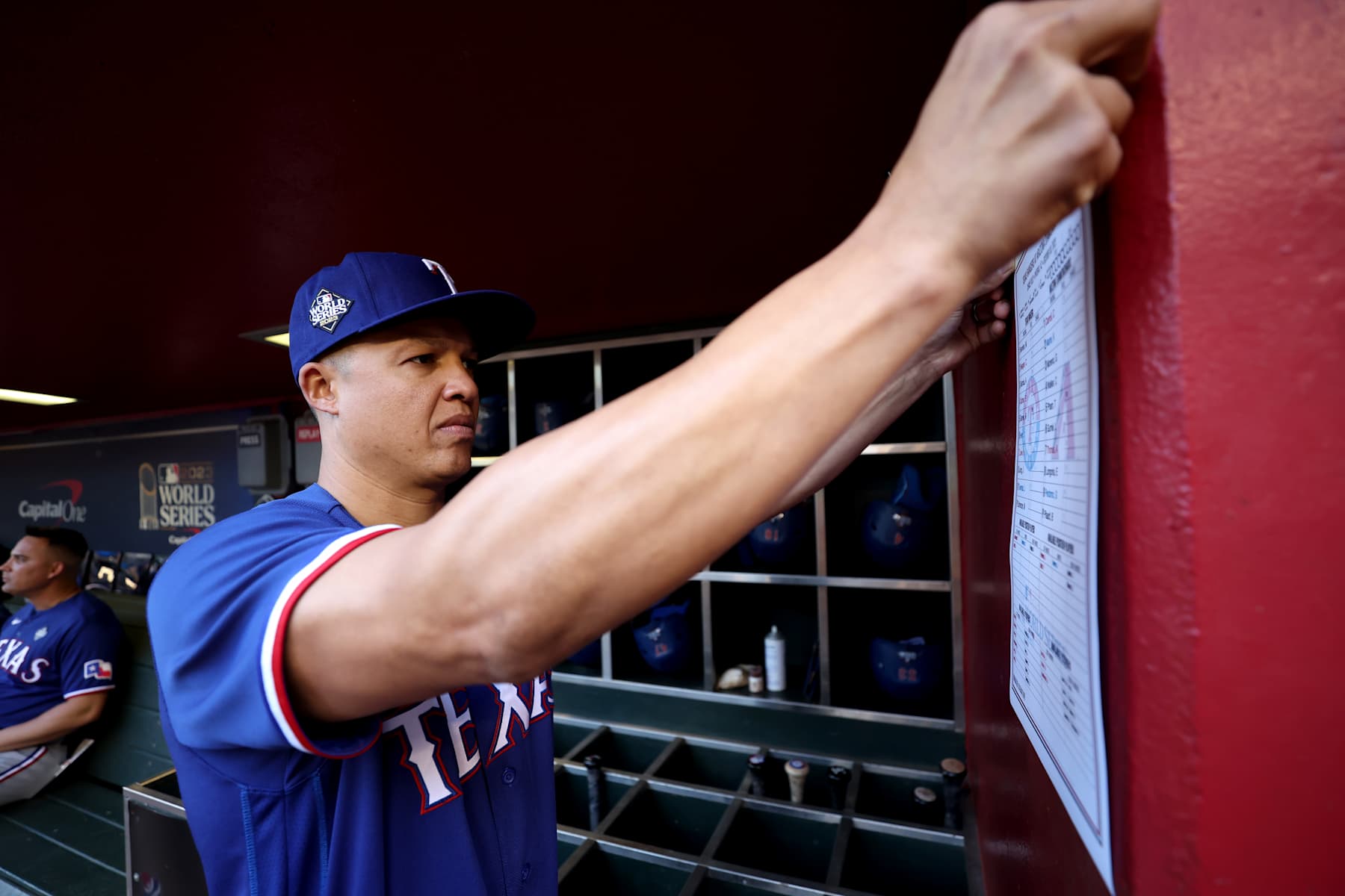 PHOENIX, ARIZONA - OCTOBER 30: Associate manager Will Venable of the Texas Rangers posts the lineup in the dugout before Game Three of the World Series against the Arizona Diamondbacks at Chase Field on October 30, 2023 in Phoenix, Arizona. (Photo by Christian Petersen/Getty Images)
