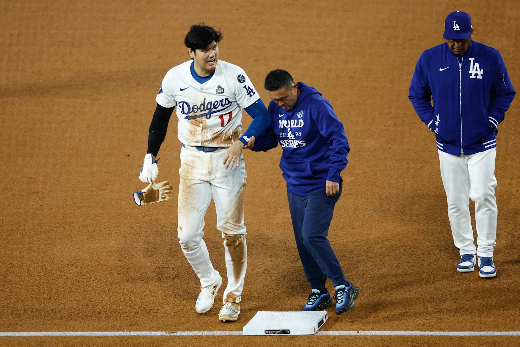 LOS ANGELES, CALIFORNIA - OCTOBER 26: Shohei Ohtani #17 of the Los Angeles Dodgers walks off the field after being injured while attempting to steal second base as they play against the New York Yankees in the seventh inning during Game Two of the 2024 World Series at Dodger Stadium on October 26, 2024 in Los Angeles, California. (Photo by Kevork Djansezian/Getty Images)