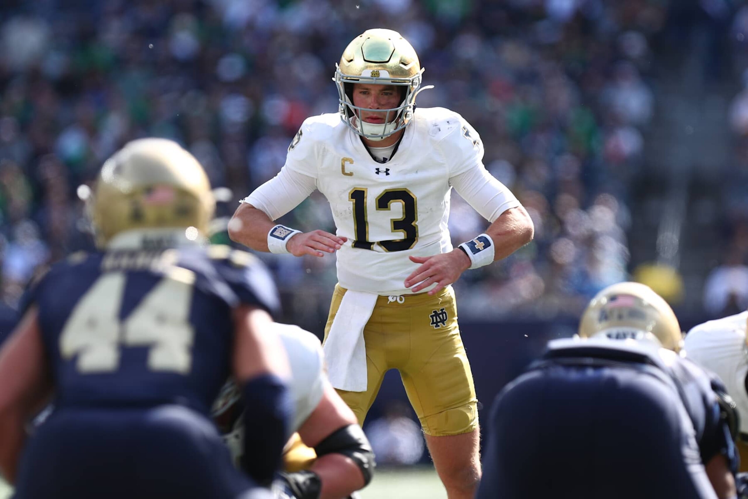 NEW YORK, NEW YORK - OCTOBER 26: Riley Leonard #13 of the Notre Dame Fighting Irish calls out a play at the line of scrimmage during the first half of the game against the Navy Midshipmen at Met Life Stadium on October 26, 2024 in New York City. (Photo by Edward Diller/Getty Images) NEW YORK, NEW YORK - OCTOBER 26: Riley Leonard #13 of the Notre Dame Fighting Irish calls out a play at the line of scrimmage during the first half of the game against the Navy Midshipmen at Met Life Stadium on October 26, 2024 in New York City. (Photo by Edward Diller/Getty Images)