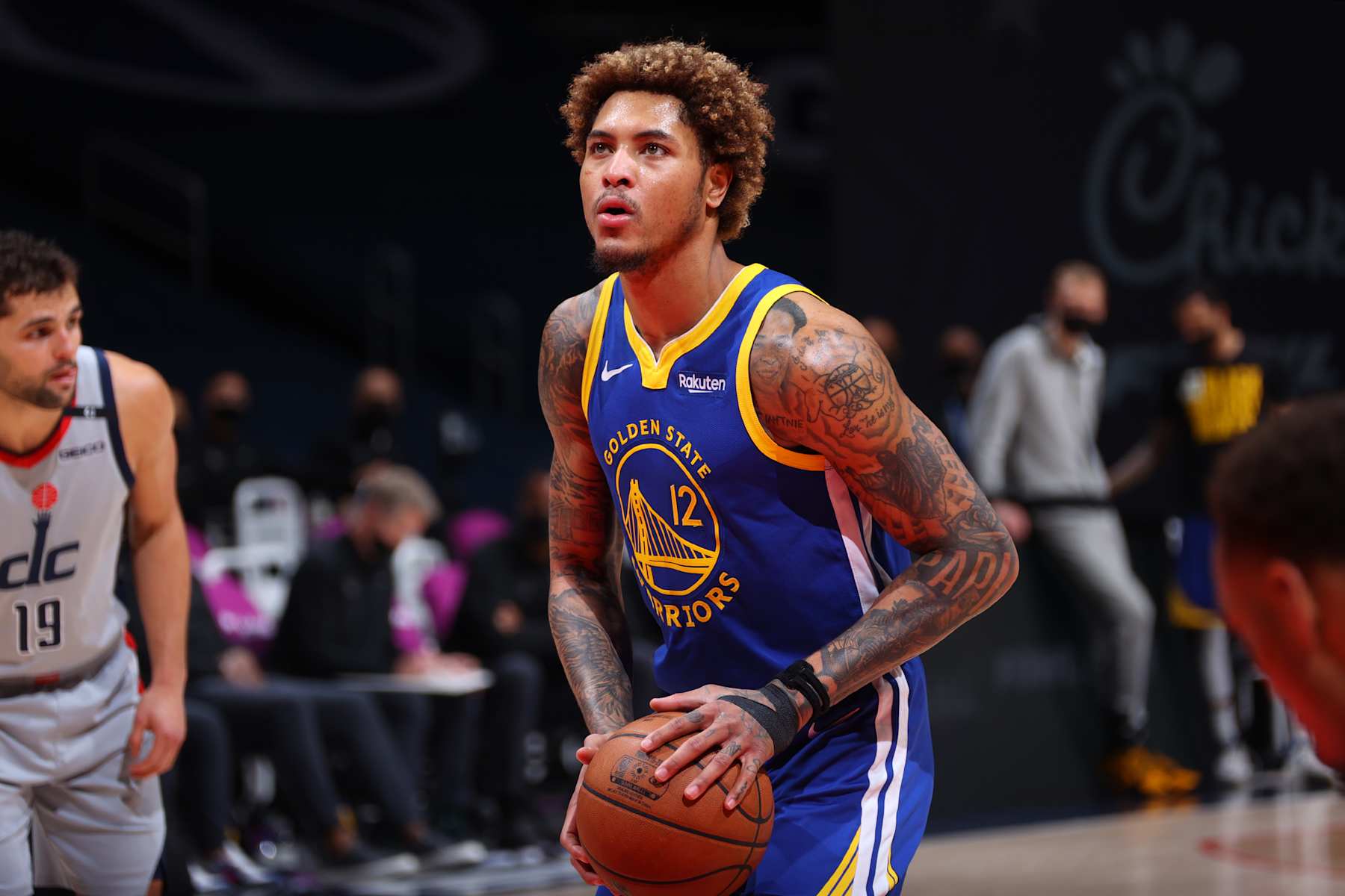 WASHINGTON, DC -  APRIL 21: Kelly Oubre Jr. #12 of the Golden State Warriors shoots a free throw during the game against the Washington Wizards on April 21, 2021 at Capital One Arena in Washington, DC. NOTE TO USER: User expressly acknowledges and agrees that, by downloading and or using this Photograph, user is consenting to the terms and conditions of the Getty Images License Agreement. Mandatory Copyright Notice: Copyright 2021 NBAE (Photo by Ned Dishman/NBAE via Getty Images)