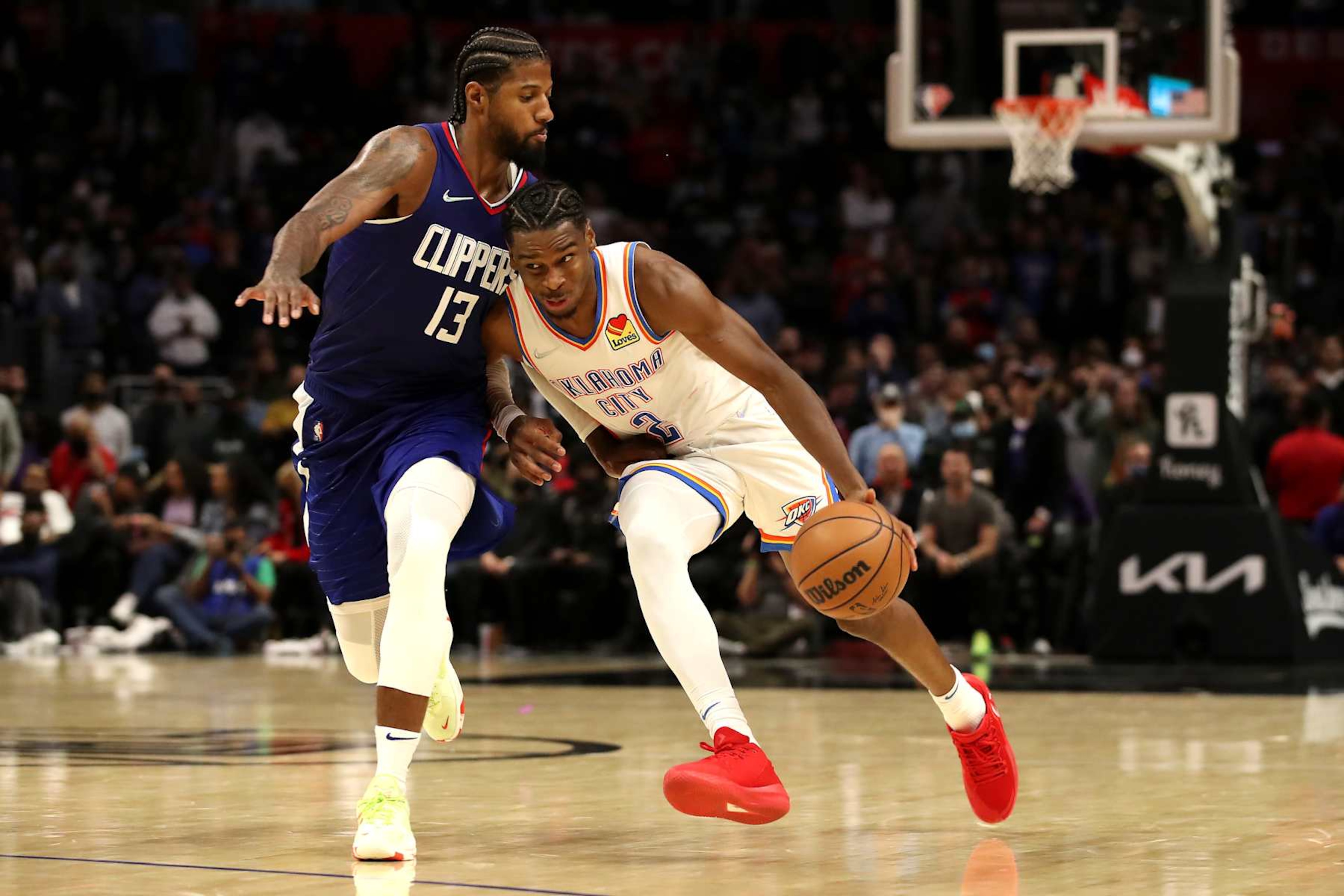 LOS ANGELES, CALIFORNIA - NOVEMBER 01: Shai Gilgeous-Alexander #2 of the Oklahoma City Thunder handles the ball against Paul George #13 of the Los Angeles Clippers during the fourth quarter at Staples Center on November 01, 2021 in Los Angeles, California. NOTE TO USER: User expressly acknowledges and agrees that, by downloading and/or using this Photograph, user is consenting to the terms and conditions of the Getty Images License Agreement. (Photo by Katelyn Mulcahy/Getty Images) LOS ANGELES, CALIFORNIA - NOVEMBER 01: Shai Gilgeous-Alexander #2 of the Oklahoma City Thunder handles the ball against Paul George #13 of the Los Angeles Clippers during the fourth quarter at Staples Center on November 01, 2021 in Los Angeles, California. NOTE TO USER: User expressly acknowledges and agrees that, by downloading and/or using this Photograph, user is consenting to the terms and conditions of the Getty Images License Agreement. (Photo by Katelyn Mulcahy/Getty Images)