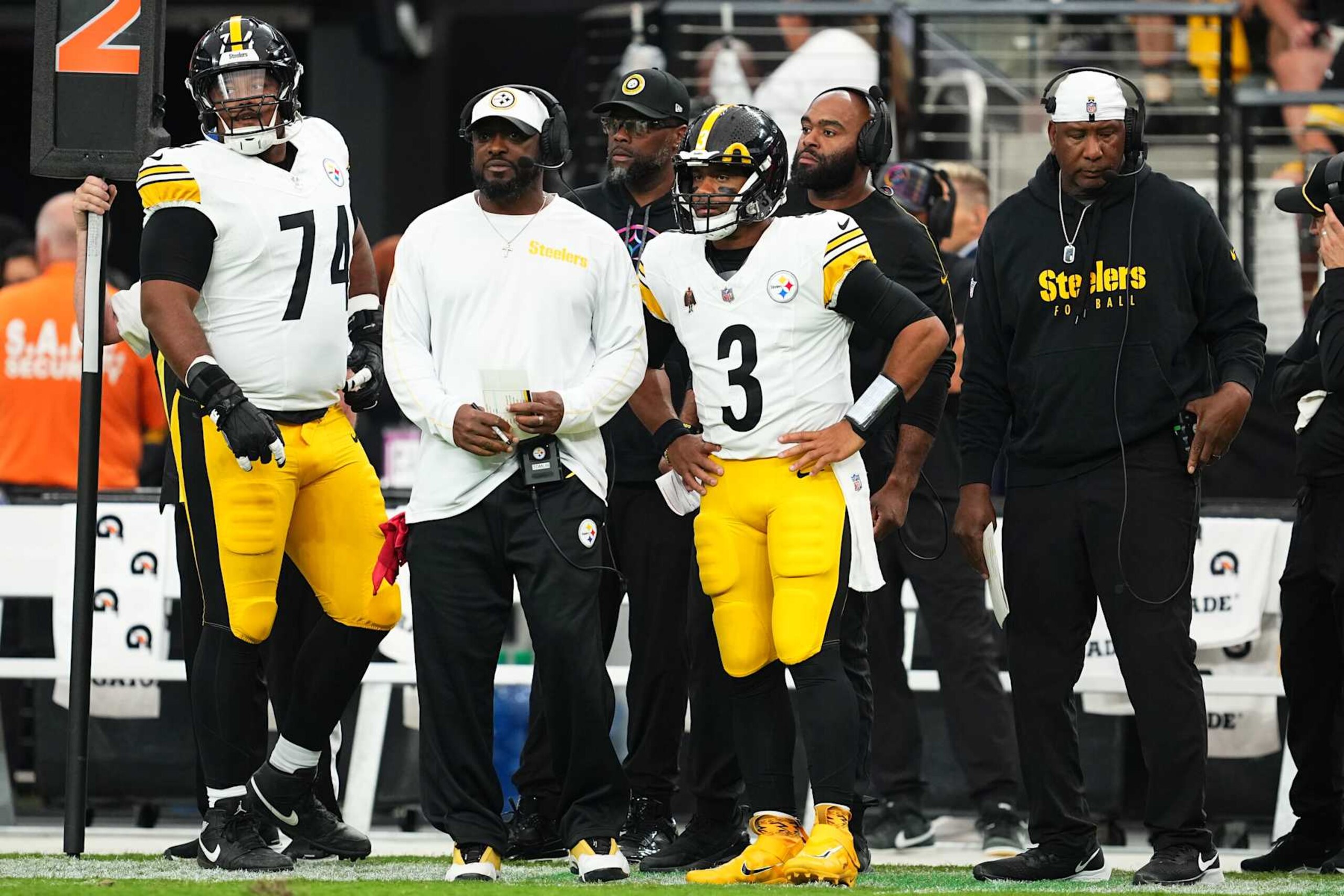LAS VEGAS, NEVADA - OCTOBER 13: Pittsburgh Steelers head coach Mike Tomlin and Russell Wilson #3 of the Pittsburgh Steelers look on from the sideline during the third quarter of a game against the Las Vegas Raiders at Allegiant Stadium on October 13, 2024 in Las Vegas, Nevada. (Photo by Chris Unger/Getty Images)