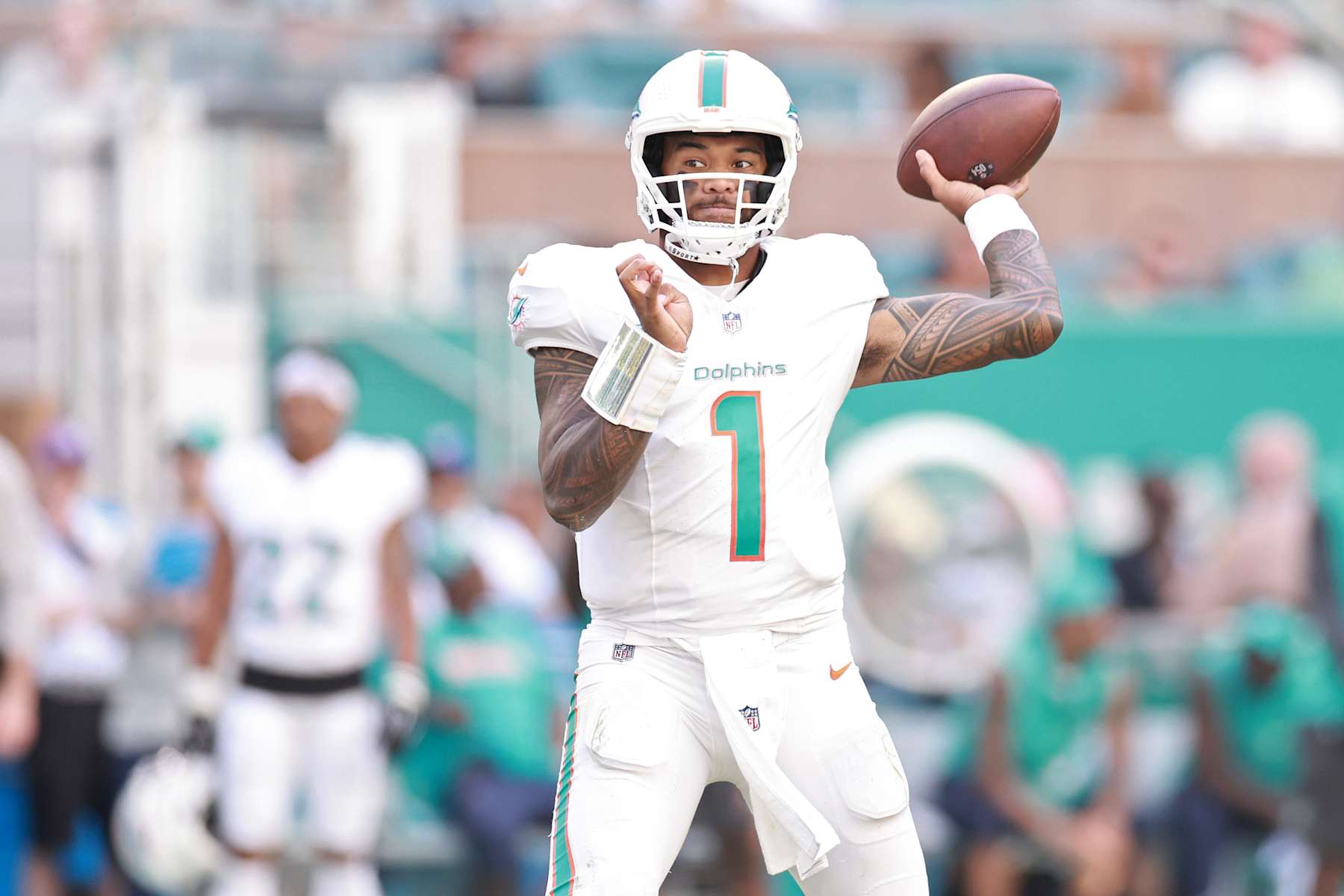 MIAMI GARDENS, FLORIDA - OCTOBER 27: Tua Tagovailoa #1 of the Miami Dolphins looks to pass in the fourth quarter of a game against the Arizona Cardinals at Hard Rock Stadium on October 27, 2024 in Miami Gardens, Florida. (Photo by Carmen Mandato/Getty Images)