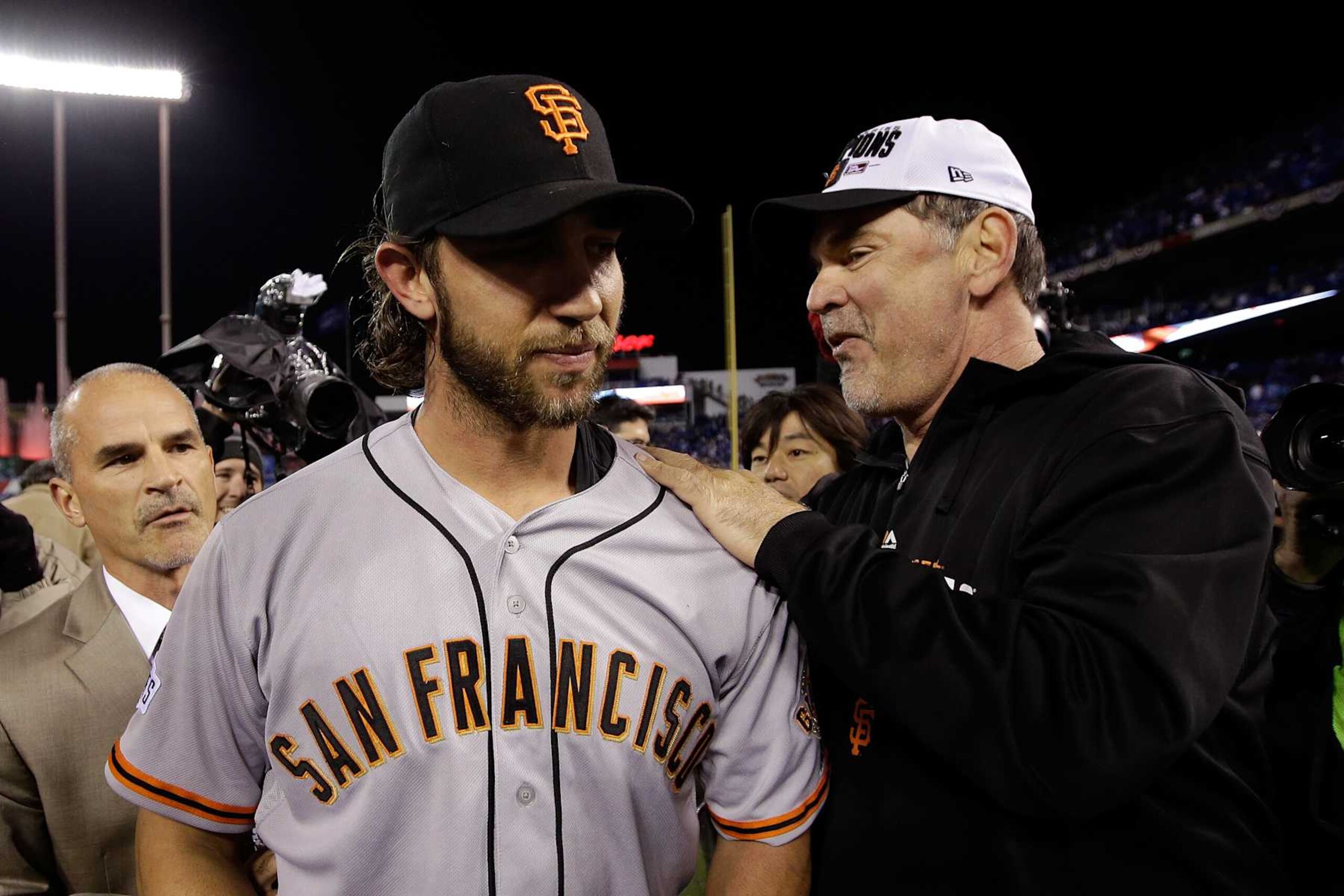 Madison Bumgarner (L) and Bruce Bochy (R) Madison Bumgarner (L) and Bruce Bochy (R)