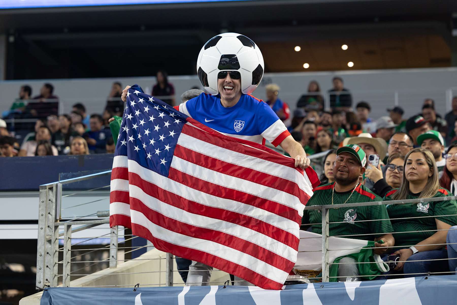 ARLINGTON, TX - MARCH 24: A USA fan waves a flag during the Concacaf Nations League Final match between Mexico and the United States on March 24, 2024 at AT&T Stadium in Arlington, Texas.  (Photo by Matthew Visinsky/Icon Sportswire via Getty Images)