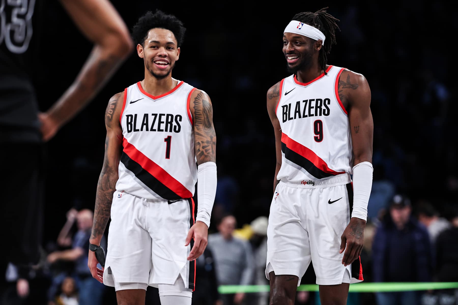 NEW YORK, NEW YORK - JANUARY 07: Anfernee Simons #1 and Jerami Grant #9 of the Portland Trail Blazers celebrate after defeating the Brooklyn Nets 134-127 in overtime at Barclays Center on January 07, 2024 in New York City. NOTE TO USER: User expressly acknowledges and agrees that, by downloading and or using this photograph, User is consenting to the terms and conditions of the Getty Images License Agreement. (Photo by Dustin Satloff/Getty Images)
