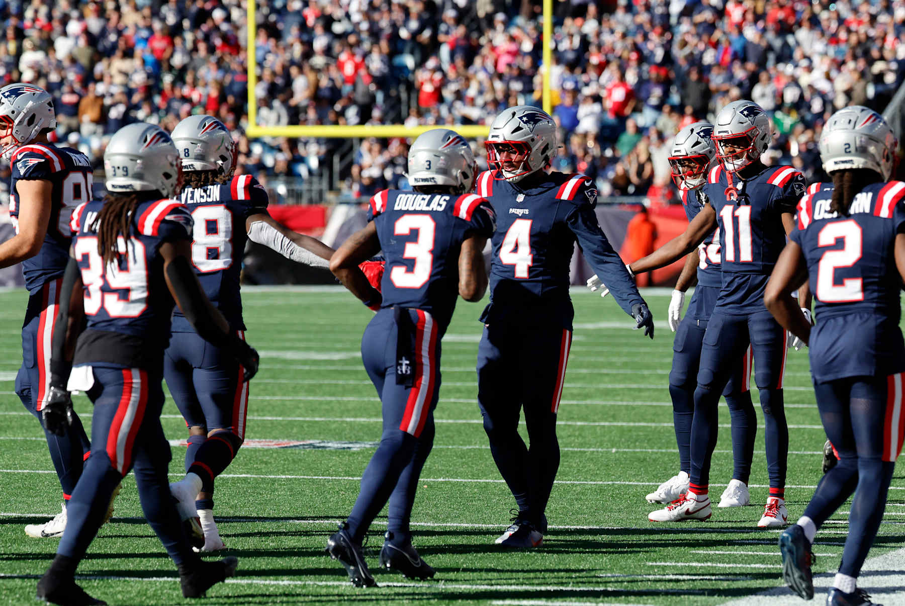 FOXBOROUGH, MA - OCTOBER 27: Teammates greet the offense after a touchdown during a game between the New England Patriots and the New York Jets on October 27, 2024, at Gillette Stadium in Foxborough, Massachusetts. (Photo by Fred Kfoury III/Icon Sportswire via Getty Images)
