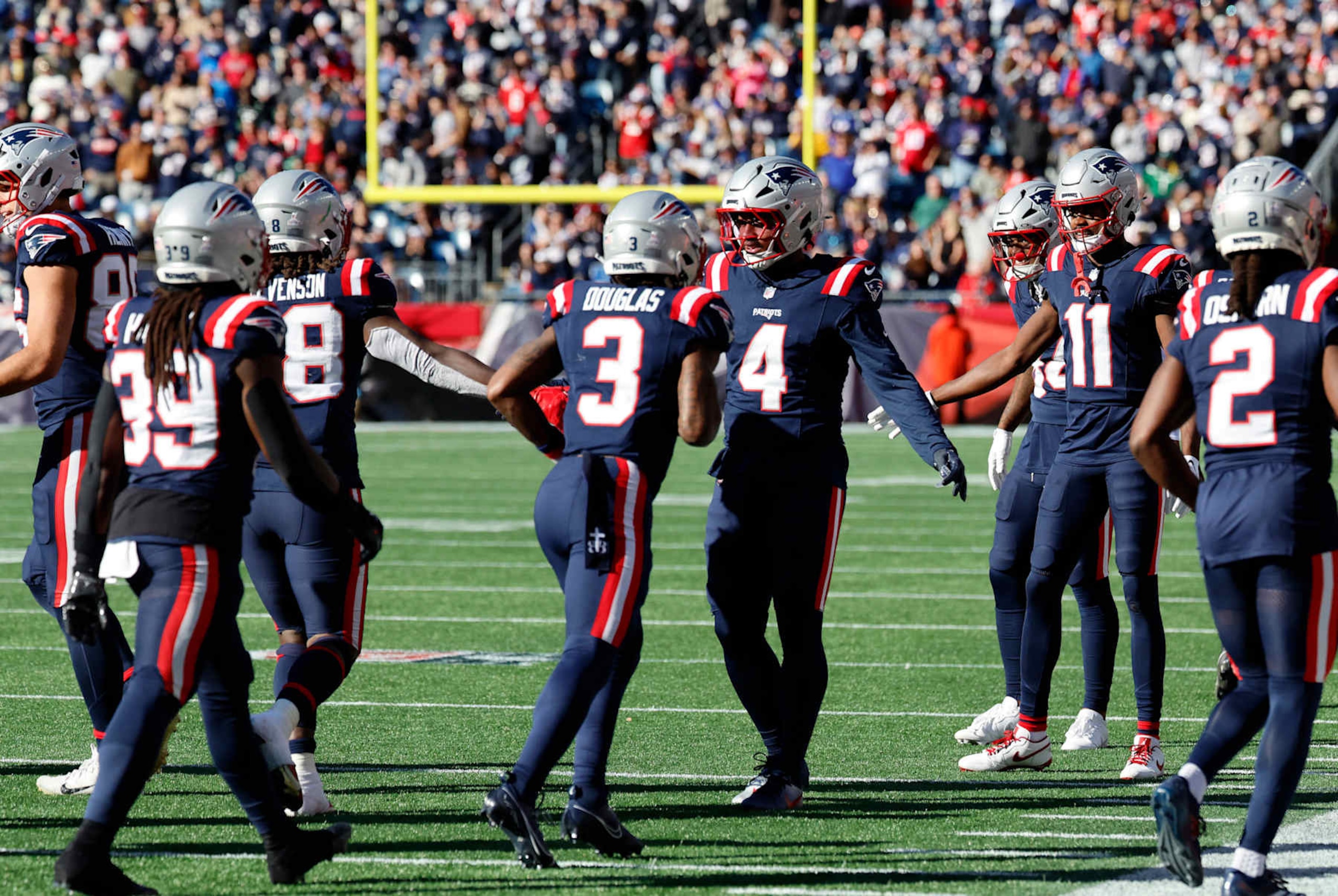 FOXBOROUGH, MA - OCTOBER 27: Teammates greet the offense after a touchdown during a game between the New England Patriots and the New York Jets on October 27, 2024, at Gillette Stadium in Foxborough, Massachusetts. (Photo by Fred Kfoury III/Icon Sportswire via Getty Images)