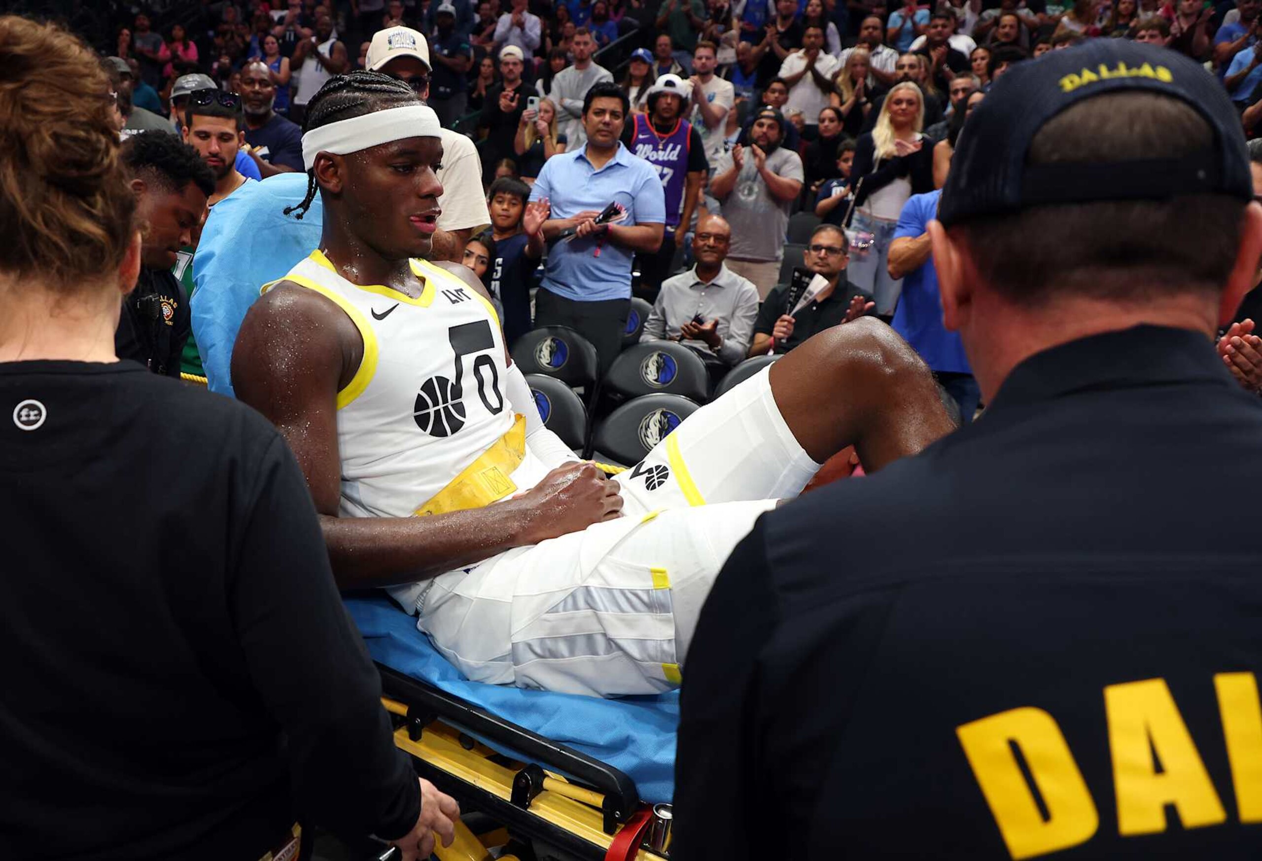 DALLAS, TEXAS - OCTOBER 28: Taylor Hendricks #0 of the Utah Jazz is wheeled out on a gurney after being injured in the third quarter of a game against the Dallas Mavericks at American Airlines Center on October 28, 2024 in Dallas, Texas. NOTE TO USER: User expressly acknowledges and agrees that, by downloading and or using this photograph, User is consenting to the terms and conditions of the Getty Images License Agreement. (Photo by Richard Rodriguez/Getty Images)