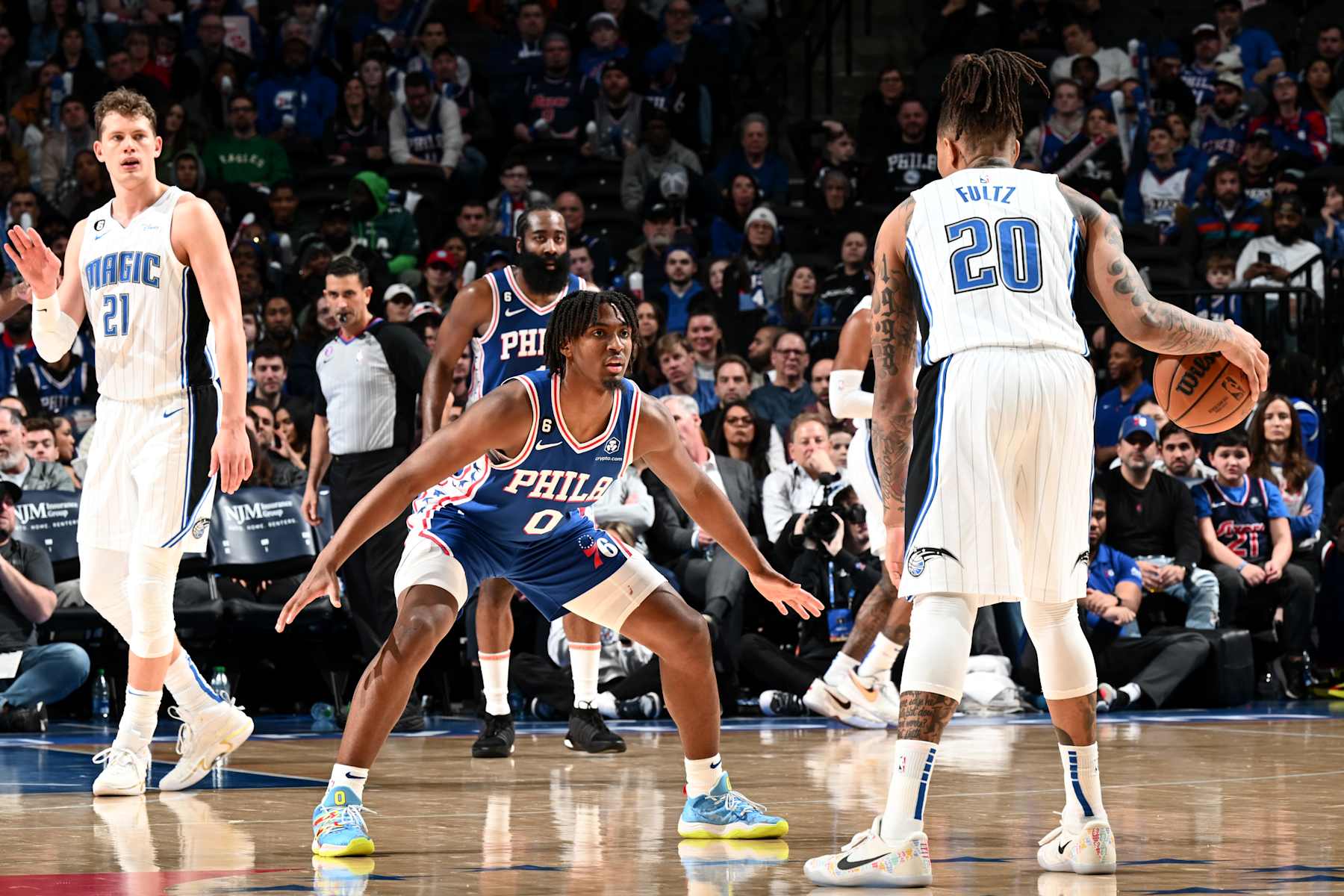 PHILADELPHIA, PA - JANUARY 30: Tyrese Maxey #0 of the Philadelphia 76ers plays defense against Markelle Fultz #20 of the Orlando Magic during the game on January 30, 2023 at the Wells Fargo Center in Philadelphia, Pennsylvania NOTE TO USER: User expressly acknowledges and agrees that, by downloading and/or using this Photograph, user is consenting to the terms and conditions of the Getty Images License Agreement. Mandatory Copyright Notice: Copyright 2023 NBAE (Photo by David Dow/NBAE via Getty Images)