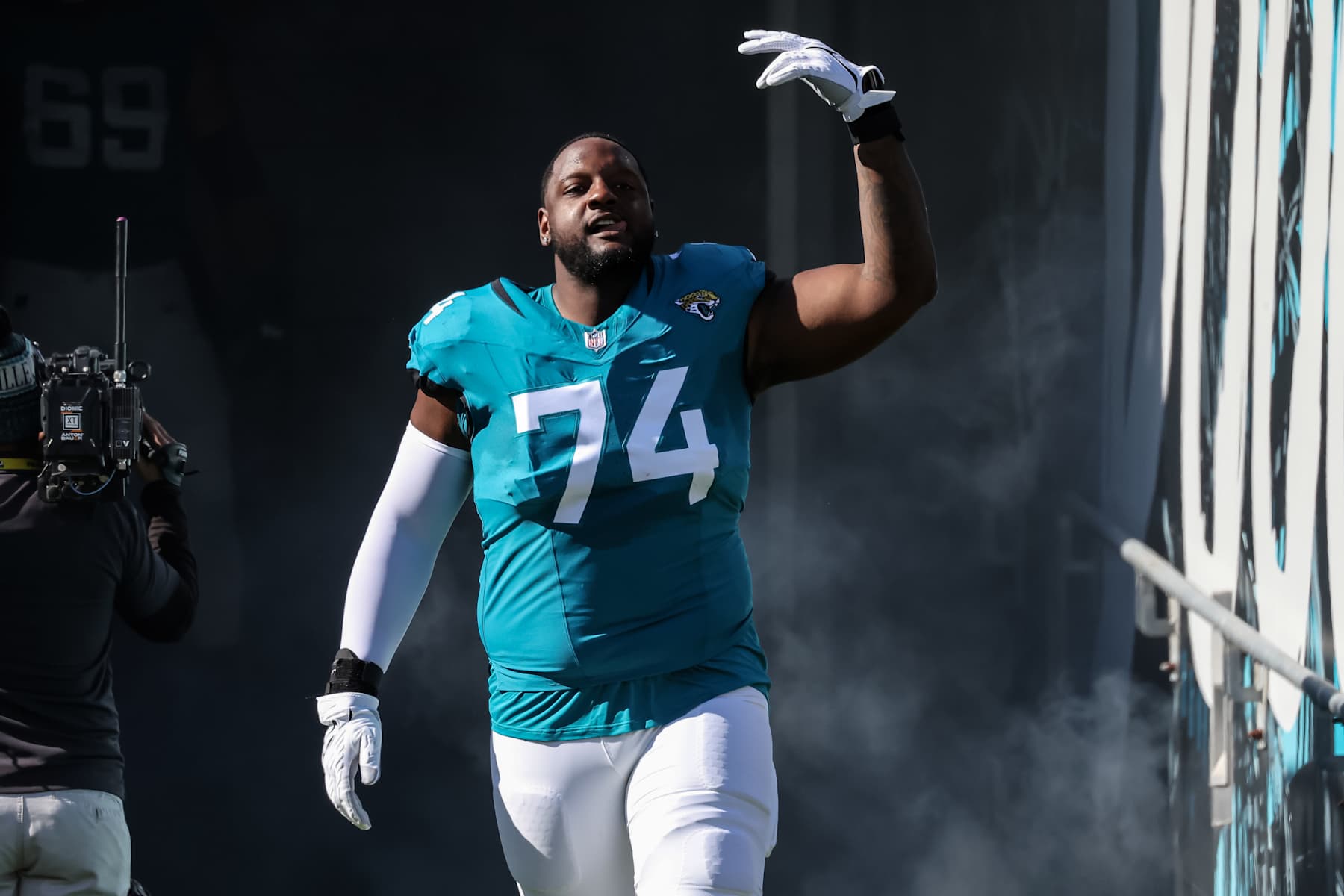 JACKSONVILLE, FLORIDA - DECEMBER 31: Cam Robinson #74 of the Jacksonville Jaguars runs out for introductions before the game against the Carolina Panthers at EverBank Stadium on December 31, 2023 in Jacksonville, Florida. (Photo by Mike Carlson/Getty Images)