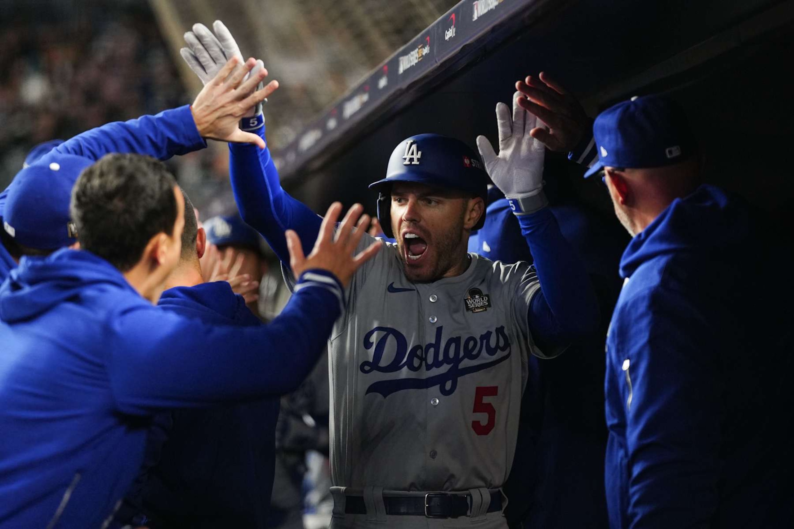NEW YORK, NY - OCTOBER 28:   Freddie Freeman #5 of the Los Angeles Dodgers celebrates in the dugout after hitting a two-run home run in the first inning during Game 3 of the 2024 World Series presented by Capital One between the Los Angeles Dodgers and the New York Yankees at Yankee Stadium on Monday, October 28, 2024 in New York, New York. (Photo by Daniel Shirey/MLB Photos via Getty Images)