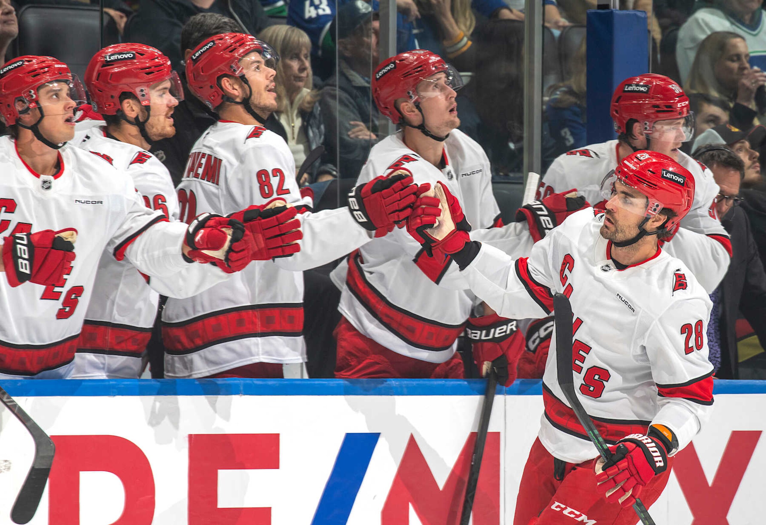 VANCOUVER, CANADA - OCTOBER 28: William Carrier #28 of the Carolina Hurricanes celebrates his goal with teammates during the first period of their NHL game against the Vancouver Canucks at Rogers Arena on October 28, 2024 in Vancouver, British Columbia, Canada.  (Photo by Jeff Vinnick/NHLI via Getty Images)