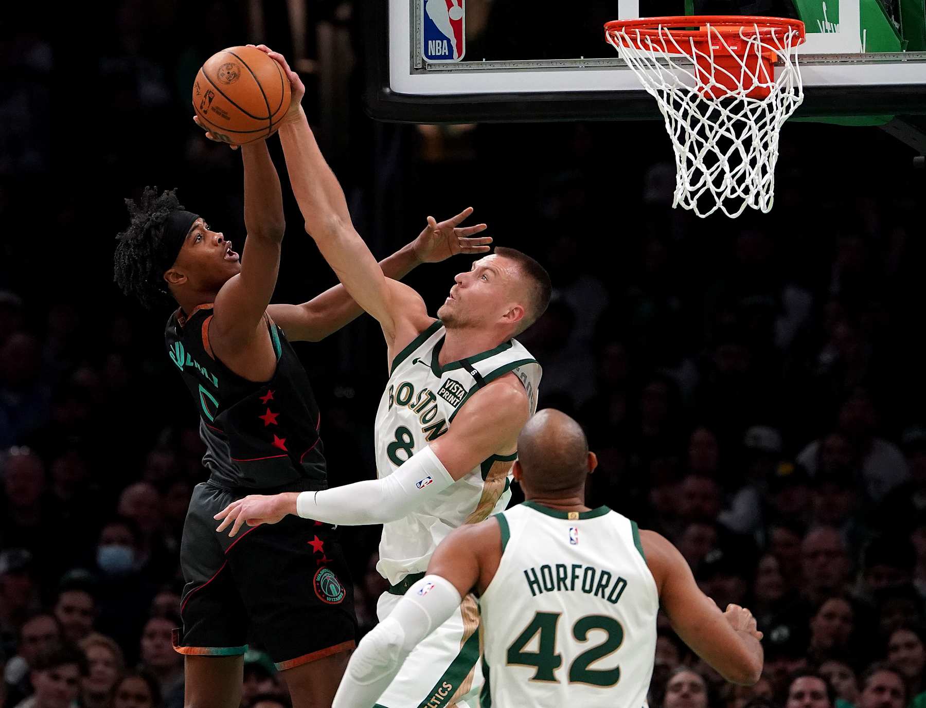 Boston, MA - February 9: Boston Celtics C Kristaps Porzingis blocks the shot of Washington Wizards SF Bilal Coulibaly in the first quarter. The Celtics beat the Wizards, 133-129. (Photo by Barry Chin/The Boston Globe via Getty Images)