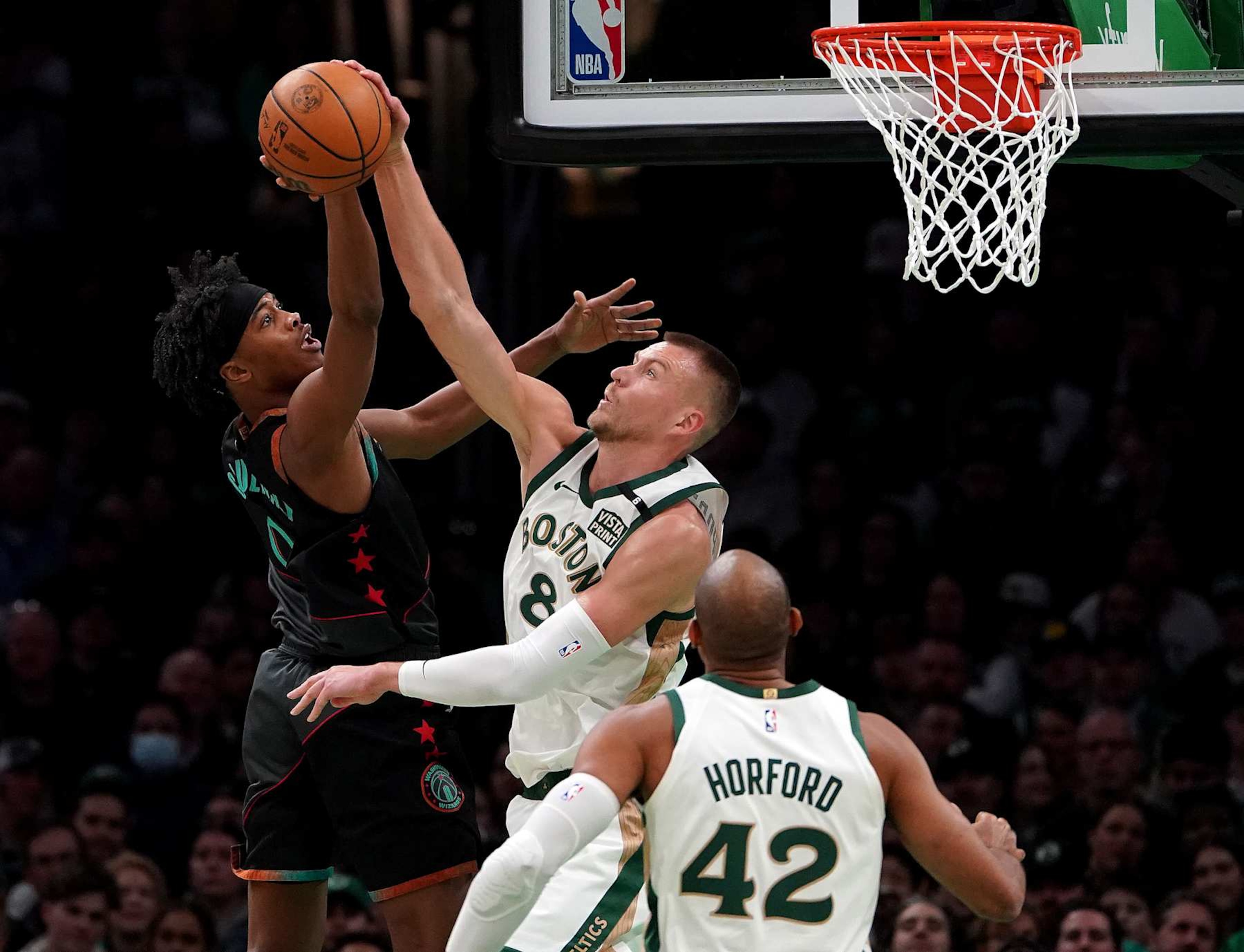Boston, MA - February 9: Boston Celtics C Kristaps Porzingis blocks the shot of Washington Wizards SF Bilal Coulibaly in the first quarter. The Celtics beat the Wizards, 133-129. (Photo by Barry Chin/The Boston Globe via Getty Images) Boston, MA - February 9: Boston Celtics C Kristaps Porzingis blocks the shot of Washington Wizards SF Bilal Coulibaly in the first quarter. The Celtics beat the Wizards, 133-129. (Photo by Barry Chin/The Boston Globe via Getty Images)
