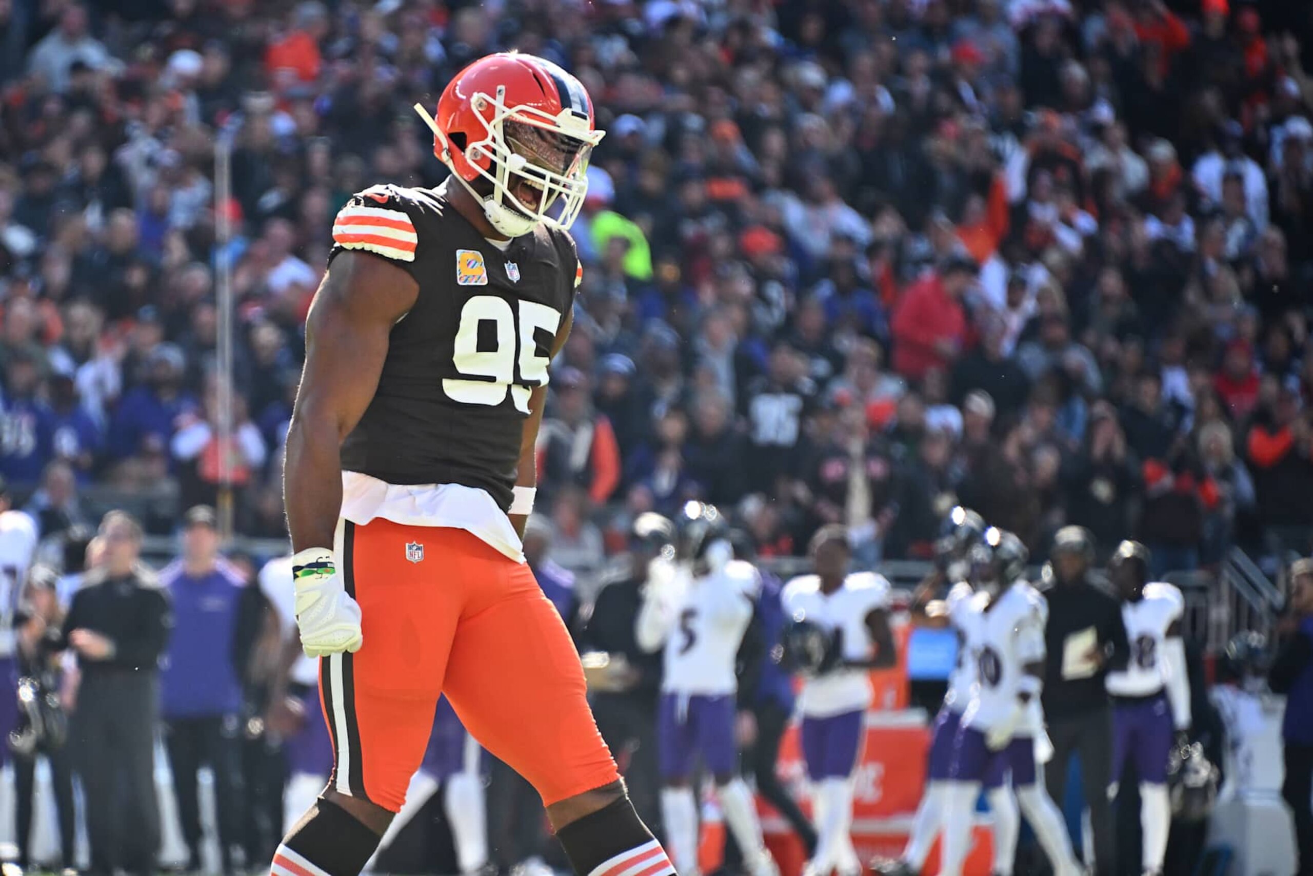 CLEVELAND, OHIO - OCTOBER 27: Myles Garrett #95 of the Cleveland Browns celebrates after a fourth down stop during the first quarter against the Baltimore Ravens at Huntington Bank Field on October 27, 2024 in Cleveland, Ohio. (Photo by Jason Miller/Getty Images)
