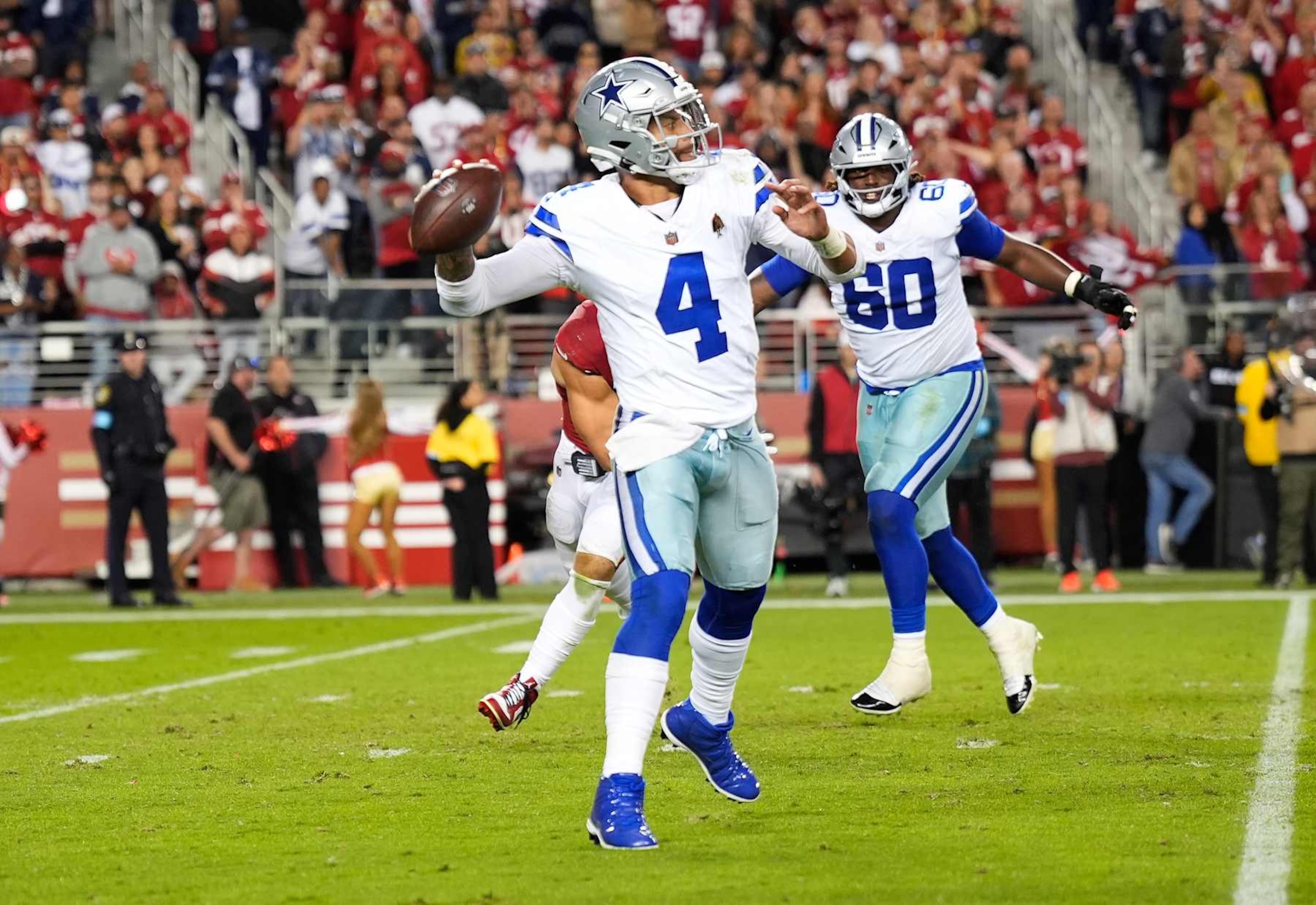 SANTA CLARA, CALIFORNIA - OCTOBER 27: Dak Prescott #4 of the Dallas Cowboys scrambling with the ball throws a pass against the San Francisco 49ers during the fourth quarter of an NFL football game at Levi's Stadium on October 27, 2024 in Santa Clara, California. (Photo by Thearon W. Henderson/Getty Images)