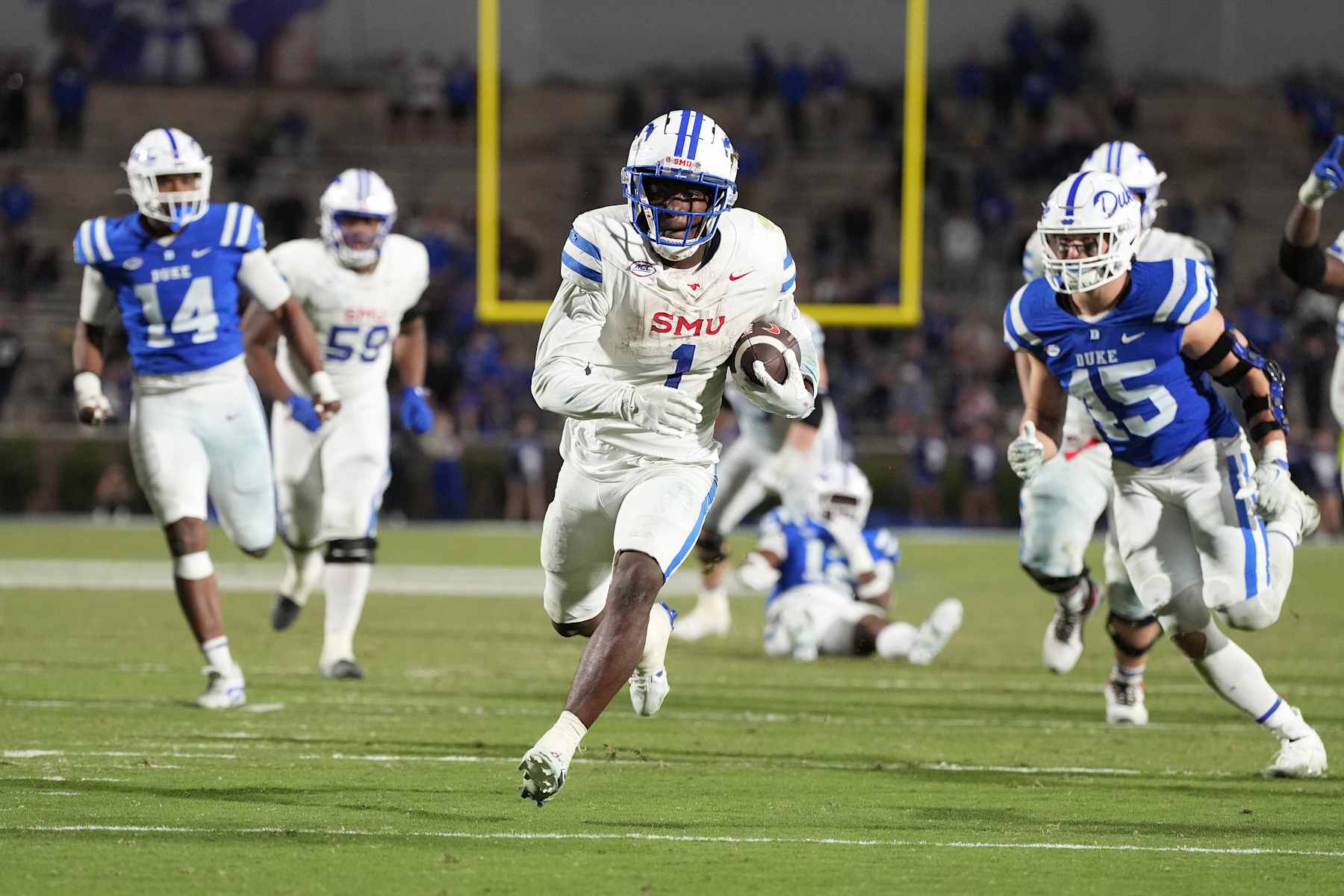 DURHAM, NORTH CAROLINA - OCTOBER 26:  Brashard Smith #1 of the Southern Methodist Mustangs runs for a touchdown in overtime against the Duke Blue Devils during the game at Wallace Wade Stadium on October 26, 2024 in Durham, North Carolina. The Mustangs won 28-27 in overtime. (Photo by Grant Halverson/Getty Images)