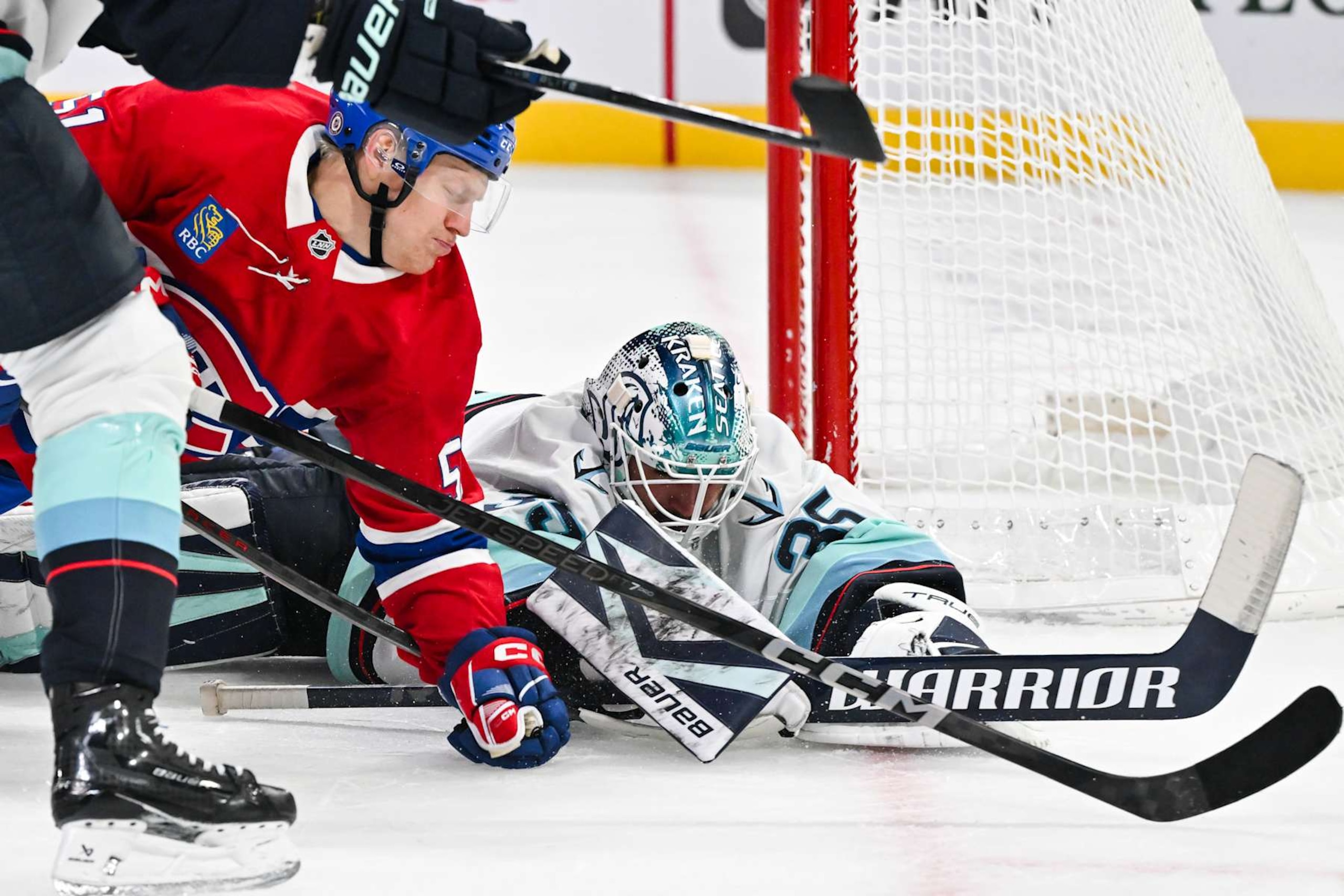 MONTREAL, CANADA - OCTOBER 29:  Goaltender Joey Daccord #35 of the Seattle Kraken covers the puck during the second period against the Montreal Canadiens at the Bell Centre on October 29, 2024 in Montreal, Quebec, Canada.  (Photo by Minas Panagiotakis/Getty Images)