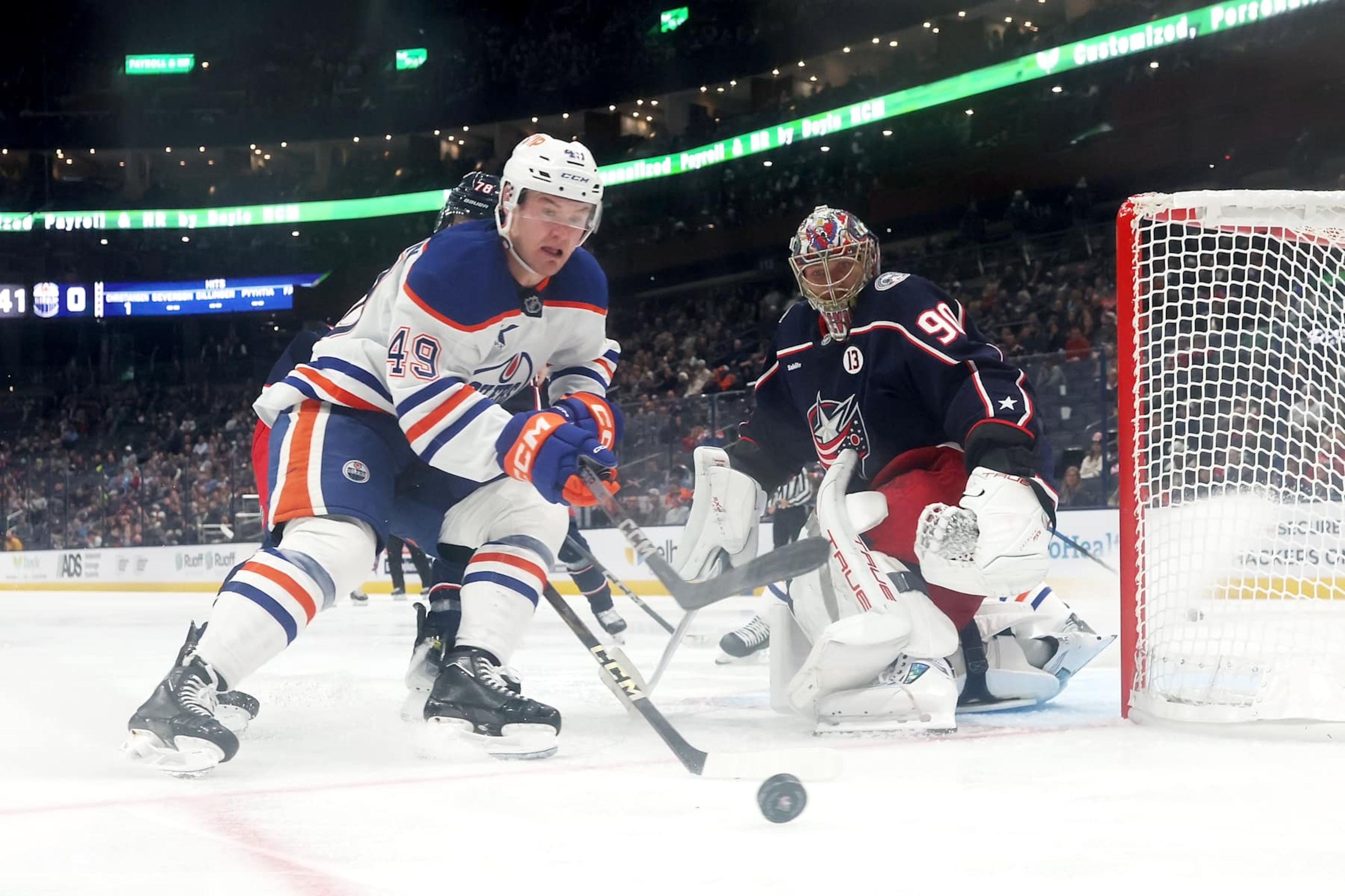 COLUMBUS, OHIO - OCTOBER 28: Ty Emberson #49 of the Edmonton Oilers gathers up the puck as it slides past Elvis Merzlikins #90 of the Columbus Blue Jackets during the third period of the game at Nationwide Arena on October 28, 2024 in Columbus, Ohio. Columbus defeated Edmonton 6-1. (Photo by Kirk Irwin/NHLI via Getty Images) COLUMBUS, OHIO - OCTOBER 28: Ty Emberson #49 of the Edmonton Oilers gathers up the puck as it slides past Elvis Merzlikins #90 of the Columbus Blue Jackets during the third period of the game at Nationwide Arena on October 28, 2024 in Columbus, Ohio. Columbus defeated Edmonton 6-1. (Photo by Kirk Irwin/NHLI via Getty Images)