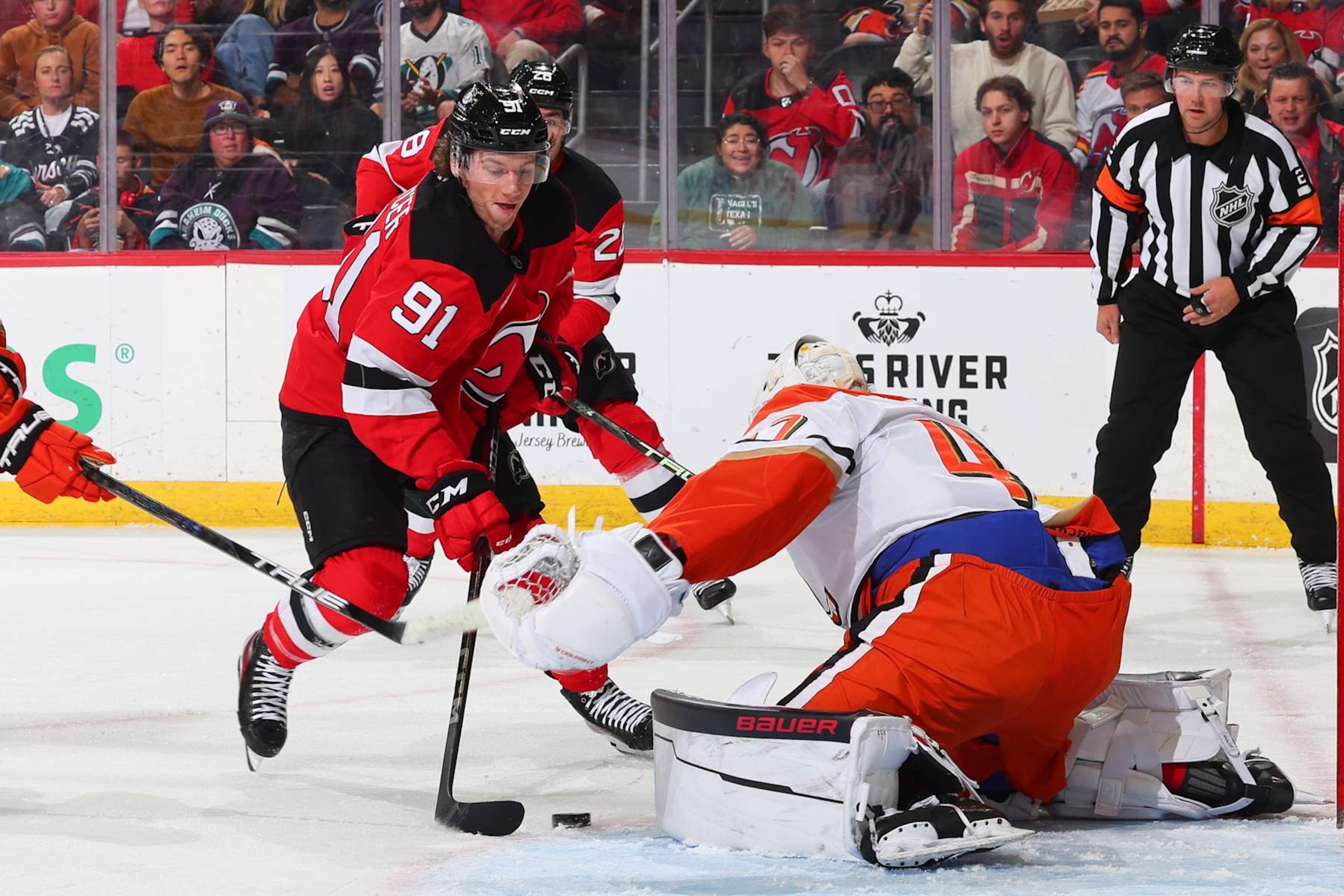 NEWARK, NJ - OCTOBER 27: Dawson Mercer #91 of the New Jersey Devils skates in the first period of the game against the Anaheim Ducks at the Prudential Center on October 27, 2024 in Newark, New Jersey.  (Photo by Rich Graessle/NHLI via Getty Images)