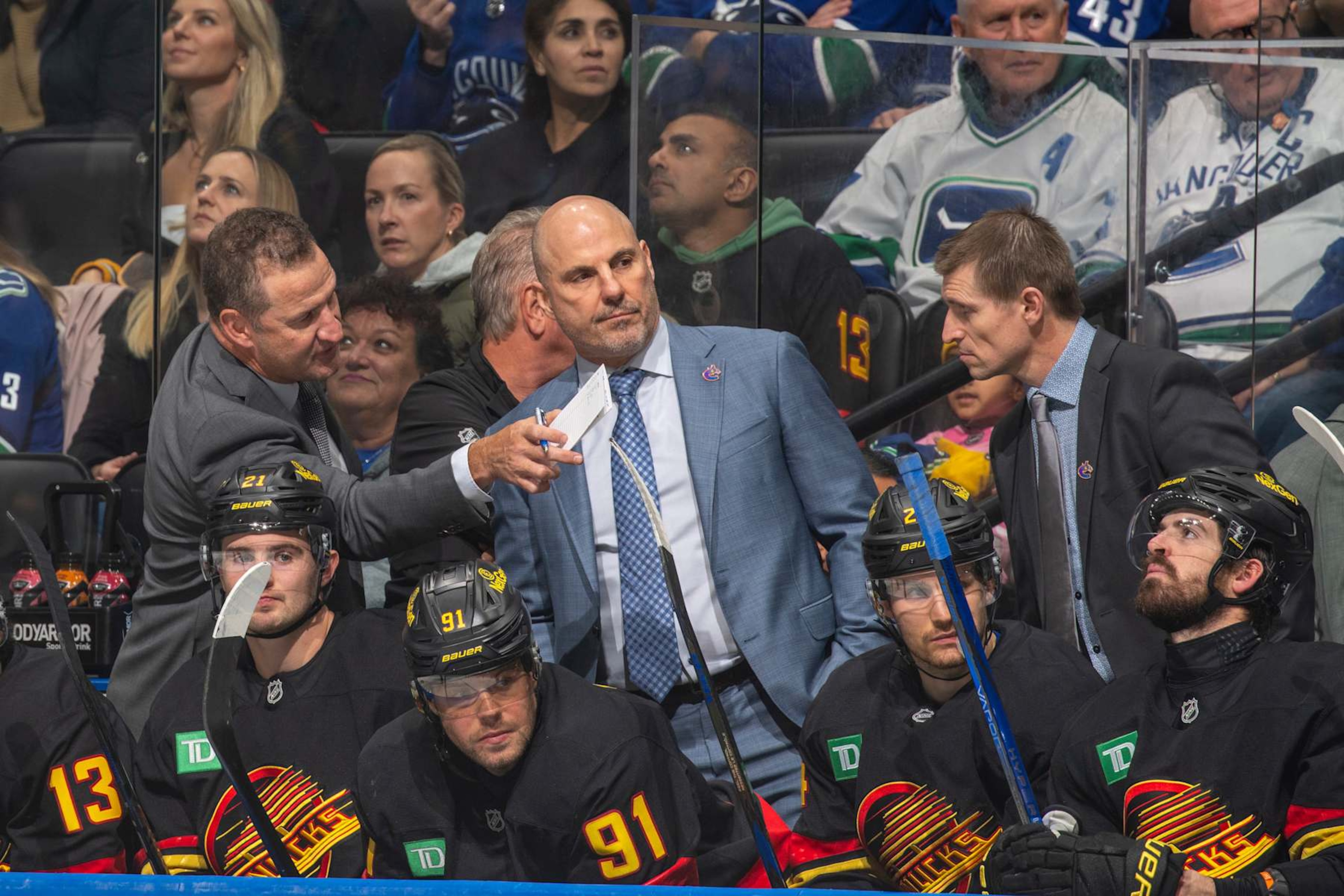 VANCOUVER, CANADA - OCTOBER 28: Head coach Rick Tocchet of the Vancouver Canucks and assistant coach Adam Foote of the Vancouver Canucks during the second period of their NHL game against the Carolina Hurricanes at Rogers Arena on October 28, 2024 in Vancouver, British Columbia, Canada. (Photo by Jeff Vinnick/NHLI via Getty Images) VANCOUVER, CANADA - OCTOBER 28: Head coach Rick Tocchet of the Vancouver Canucks and assistant coach Adam Foote of the Vancouver Canucks during the second period of their NHL game against the Carolina Hurricanes at Rogers Arena on October 28, 2024 in Vancouver, British Columbia, Canada. (Photo by Jeff Vinnick/NHLI via Getty Images)