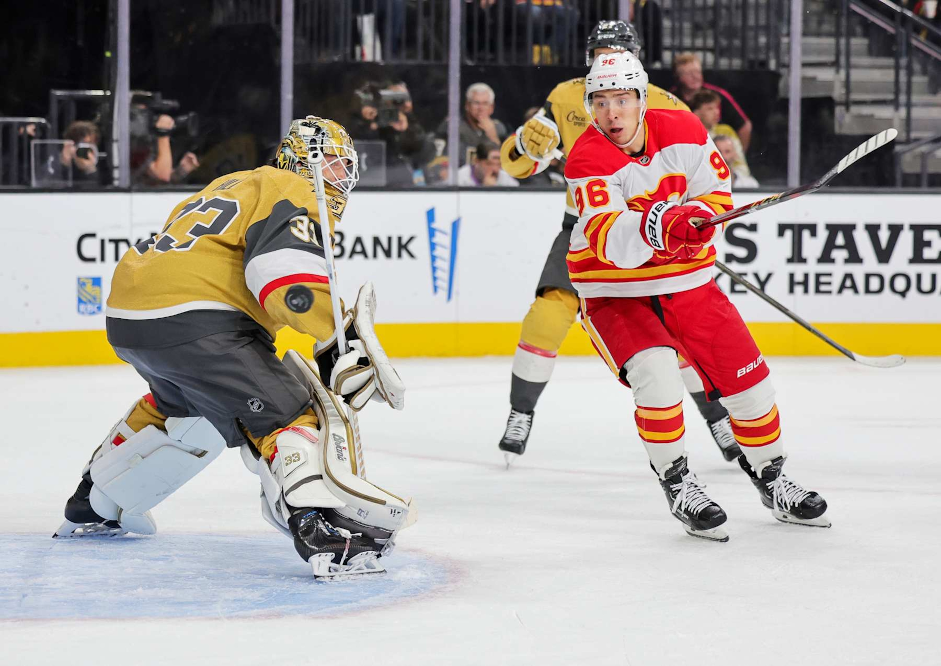 LAS VEGAS, NEVADA - OCTOBER 28: Adin Hill #33 of the Vegas Golden Knights defends the net against Andrei Kuzmenko #96 of the Calgary Flames in the first period of their game at T-Mobile Arena on October 28, 2024 in Las Vegas, Nevada. (Photo by Ethan Miller/Getty Images) LAS VEGAS, NEVADA - OCTOBER 28: Adin Hill #33 of the Vegas Golden Knights defends the net against Andrei Kuzmenko #96 of the Calgary Flames in the first period of their game at T-Mobile Arena on October 28, 2024 in Las Vegas, Nevada. (Photo by Ethan Miller/Getty Images)