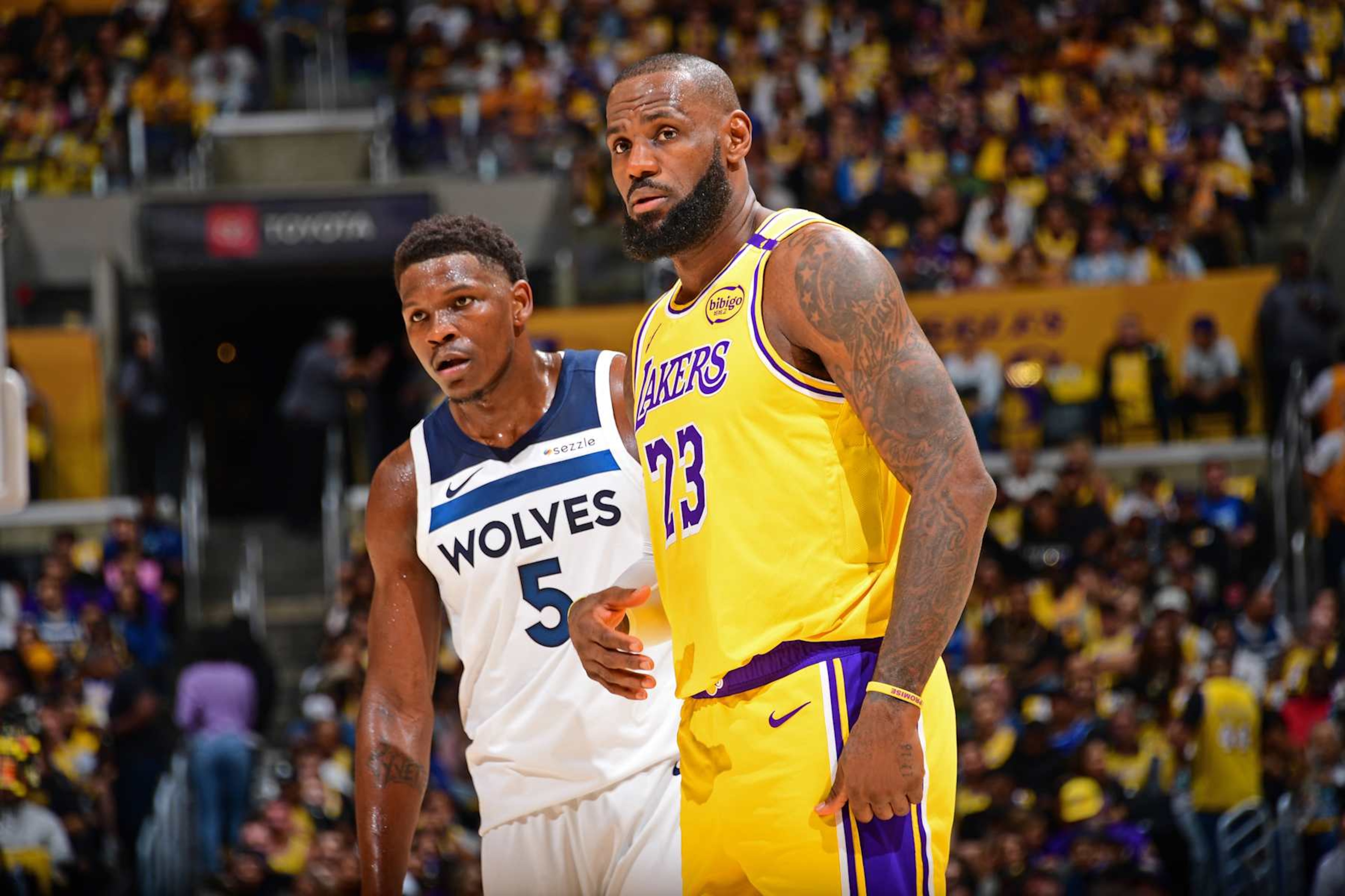 LOS ANGELES, CA - OCTOBER 22: Anthony Edwards #5 of the Minnesota Timberwolves and LeBron James #23 of the Los Angeles Lakers look on during the game on October 22, 2024 at Crypto.Com Arena in Los Angeles, California. NOTE TO USER: User expressly acknowledges and agrees that, by downloading and/or using this Photograph, user is consenting to the terms and conditions of the Getty Images License Agreement. Mandatory Copyright Notice: Copyright 2024 NBAE (Photo by Adam Pantozzi/NBAE via Getty Images) LOS ANGELES, CA - OCTOBER 22: Anthony Edwards #5 of the Minnesota Timberwolves and LeBron James #23 of the Los Angeles Lakers look on during the game on October 22, 2024 at Crypto.Com Arena in Los Angeles, California. NOTE TO USER: User expressly acknowledges and agrees that, by downloading and/or using this Photograph, user is consenting to the terms and conditions of the Getty Images License Agreement. Mandatory Copyright Notice: Copyright 2024 NBAE (Photo by Adam Pantozzi/NBAE via Getty Images)