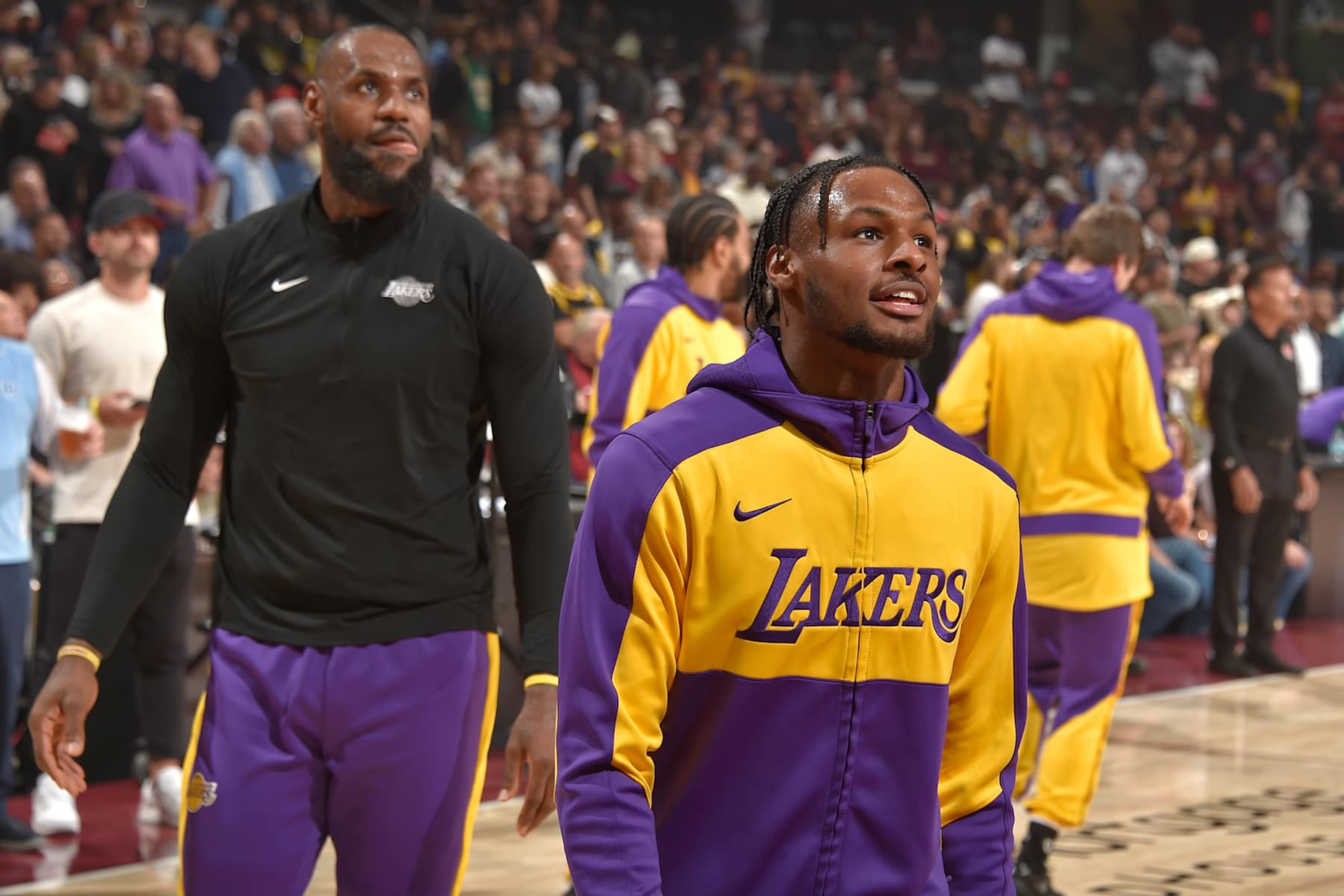 CLEVELAND, OH - OCTOBER 30: LeBron James #23 and Bronny James #9 of the Los Angeles Lakers look on before the game against the Cleveland Cavaliers on October 30, 2024 at Rocket Mortgage FieldHouse in Cleveland, Ohio. NOTE TO USER: User expressly acknowledges and agrees that, by downloading and/or using this Photograph, user is consenting to the terms and conditions of the Getty Images License Agreement. Mandatory Copyright Notice: Copyright 2024 NBAE (Photo by David Liam Kyle/NBAE via Getty Images)