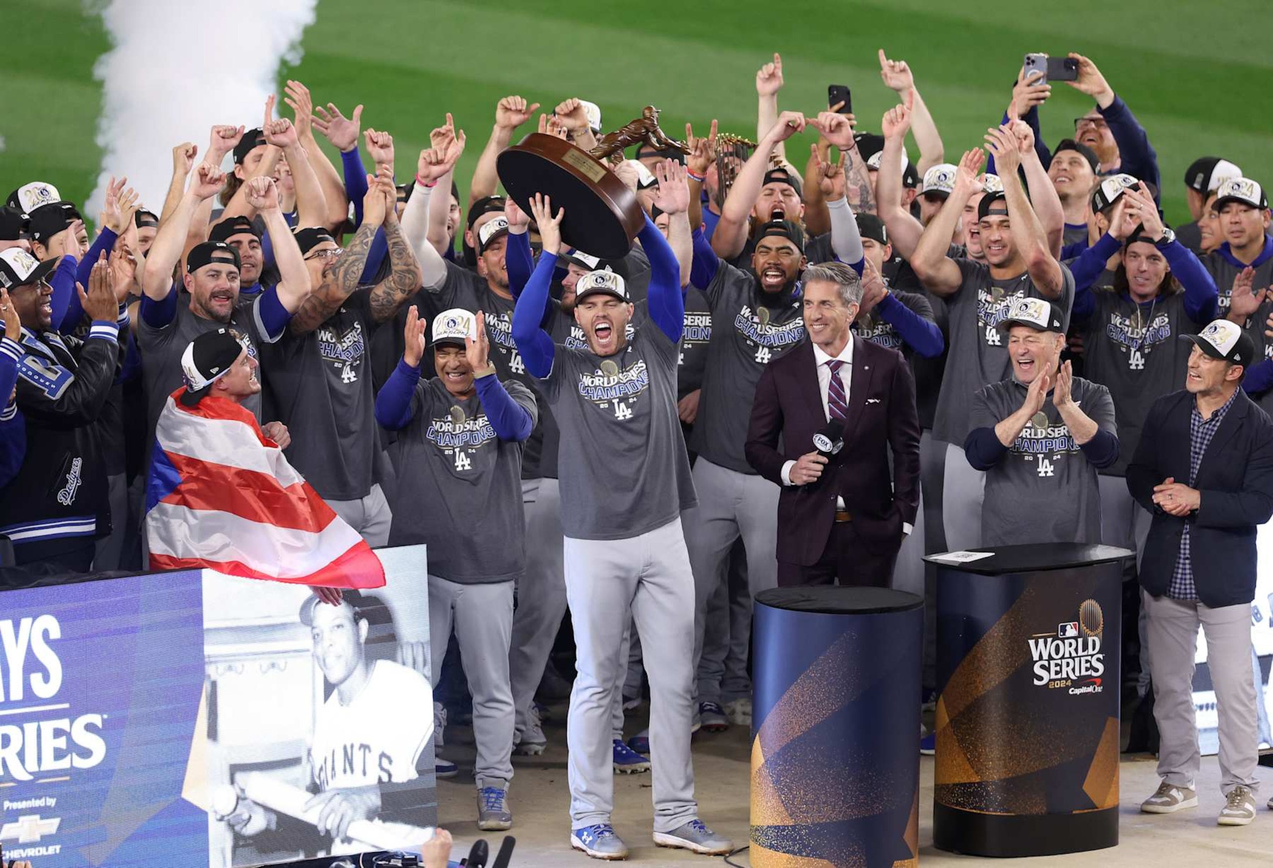 NEW YORK, NEW YORK - OCTOBER 30:  Freddie Freeman #5 of the Los Angeles Dodgers celebrates with the MVP trophy with teammates after defeating the New York Yankees 7-6 in game 5 to win the 2024 World Series at Yankee Stadium on October 30, 2024 in the Bronx borough of New York City. (Photo by Luke Hales/Getty Images)