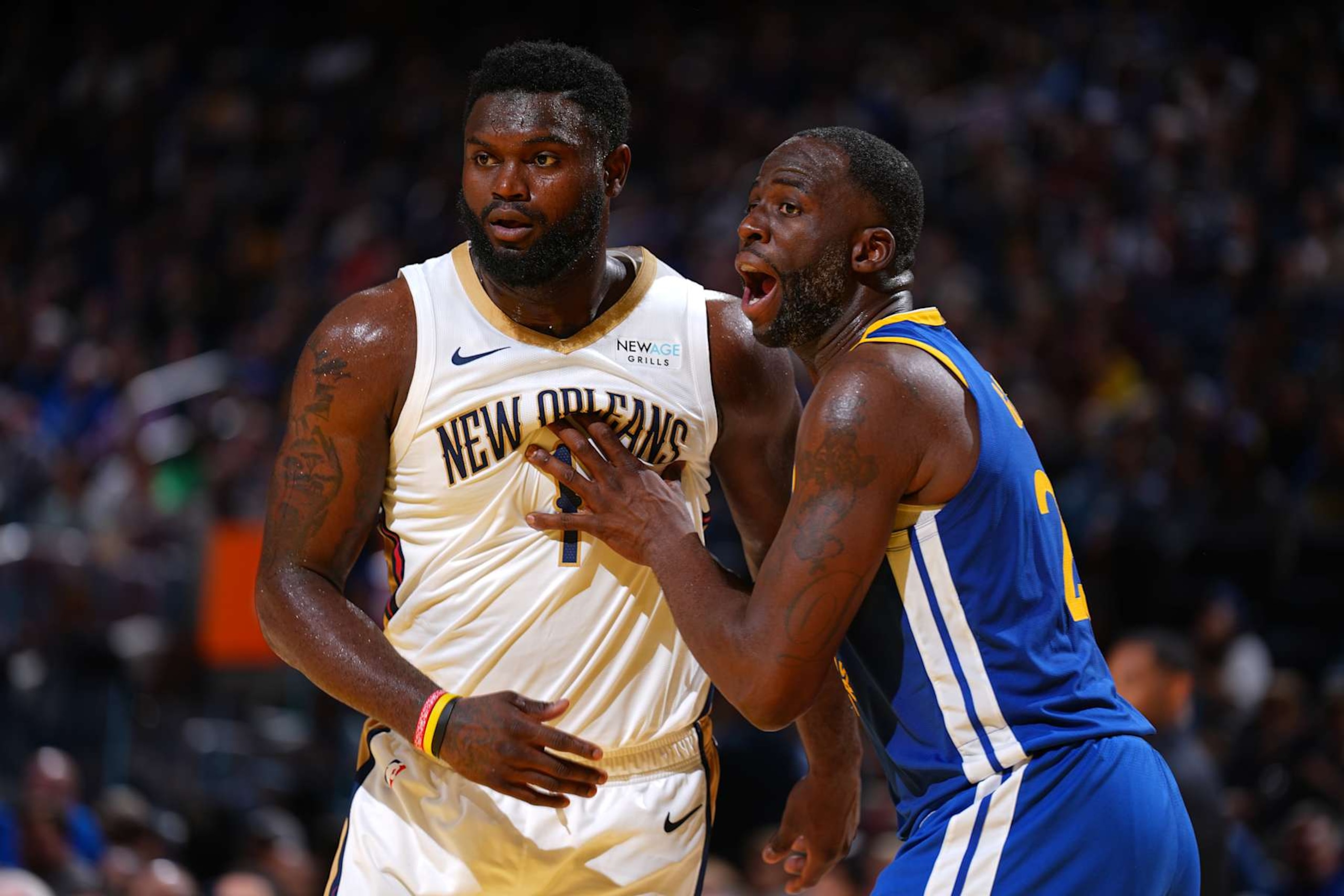 SAN FRANCISCO, CA - OCTOBER 30: Zion Williamson #1 of the New Orleans Pelicans and Draymond Green #23 of the Golden State Warriors look on during the game on October 30, 2024 at Chase Center in San Francisco, California. NOTE TO USER: User expressly acknowledges and agrees that, by downloading and or using this photograph, user is consenting to the terms and conditions of Getty Images License Agreement. Mandatory Copyright Notice: Copyright 2024 NBAE (Photo by Garrett Ellwood/NBAE via Getty Images) SAN FRANCISCO, CA - OCTOBER 30: Zion Williamson #1 of the New Orleans Pelicans and Draymond Green #23 of the Golden State Warriors look on during the game on October 30, 2024 at Chase Center in San Francisco, California. NOTE TO USER: User expressly acknowledges and agrees that, by downloading and or using this photograph, user is consenting to the terms and conditions of Getty Images License Agreement. Mandatory Copyright Notice: Copyright 2024 NBAE (Photo by Garrett Ellwood/NBAE via Getty Images)