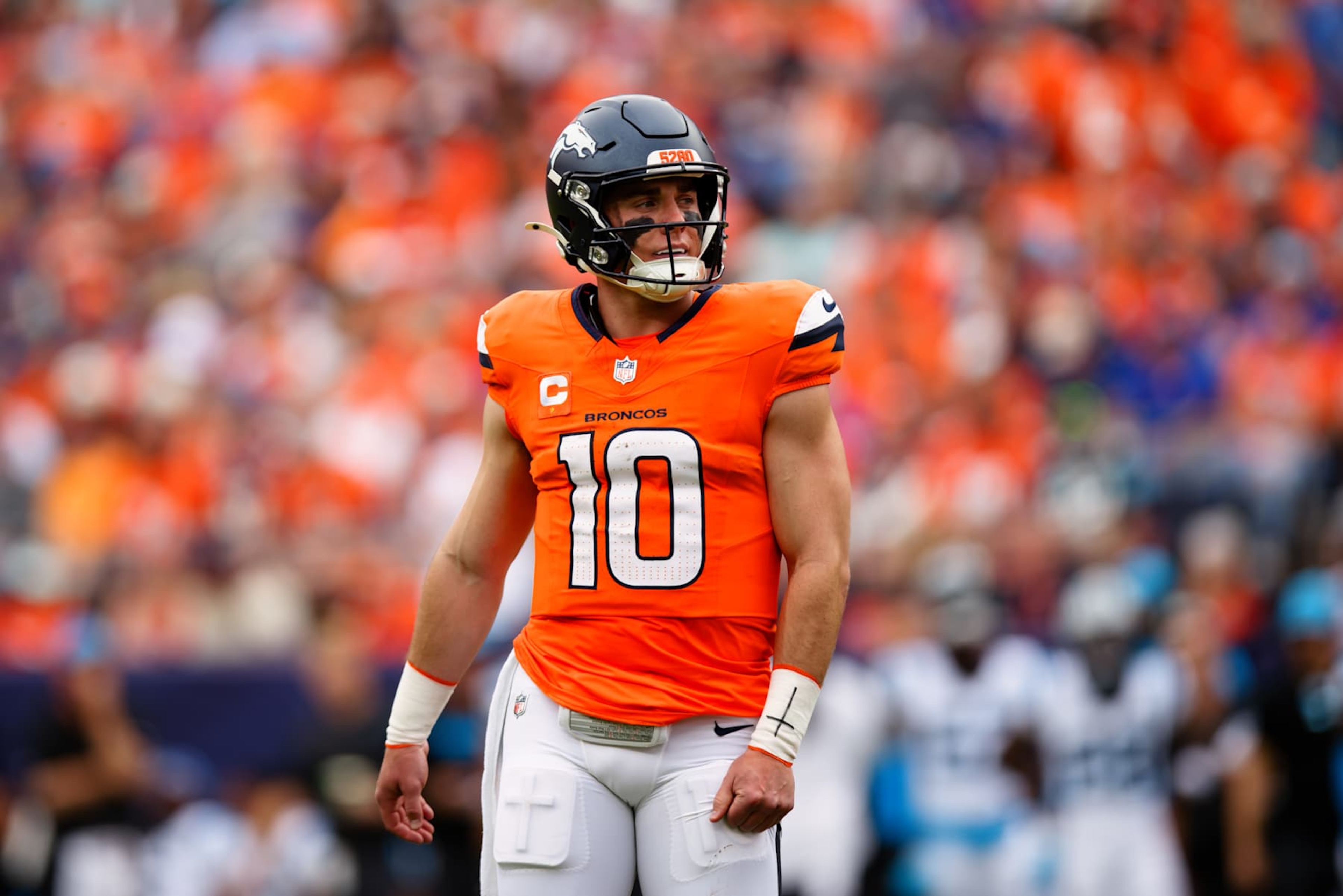 DENVER, CO - OCTOBER 27: Quarterback Bo Nix #10 of the Denver Broncos looks on from the field during the second quarter against the Carolina Panthers at Empower Field at Mile High on October 27, 2024 in Denver, Colorado. (Photo by Justin Edmonds/Getty Images) DENVER, CO - OCTOBER 27: Quarterback Bo Nix #10 of the Denver Broncos looks on from the field during the second quarter against the Carolina Panthers at Empower Field at Mile High on October 27, 2024 in Denver, Colorado. (Photo by Justin Edmonds/Getty Images)