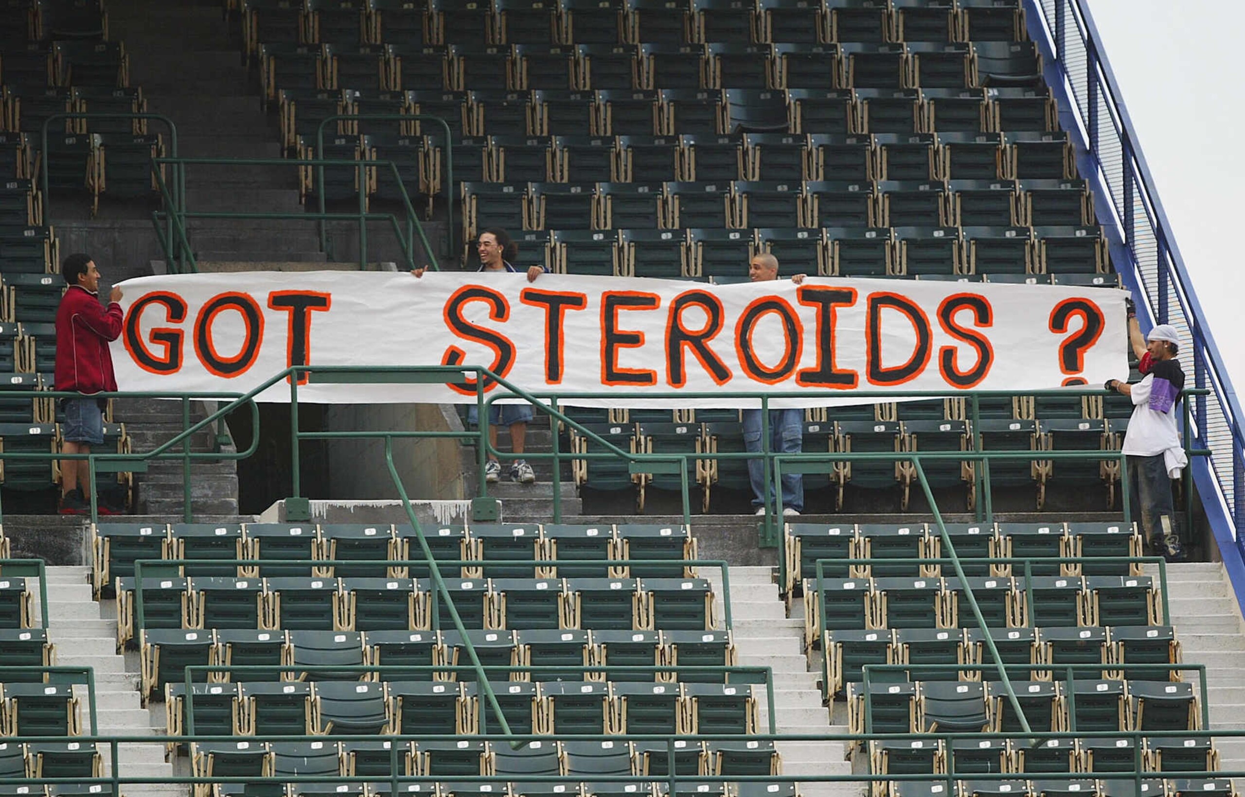 NEW YORK - MAY 5:  Fans hold up a sign which reads 'Got Steroids?' during the game between the New York Mets and the San Fransisco Giants during their game on May 5, 2004 at Shea Stadium in Flushing, New York. The sign is in support alligations that Barry Bonds of the Giants took steroids which he got from the BALCO company which is currently under a federal drug investigation. (Photo by Al Bello/Getty Images)