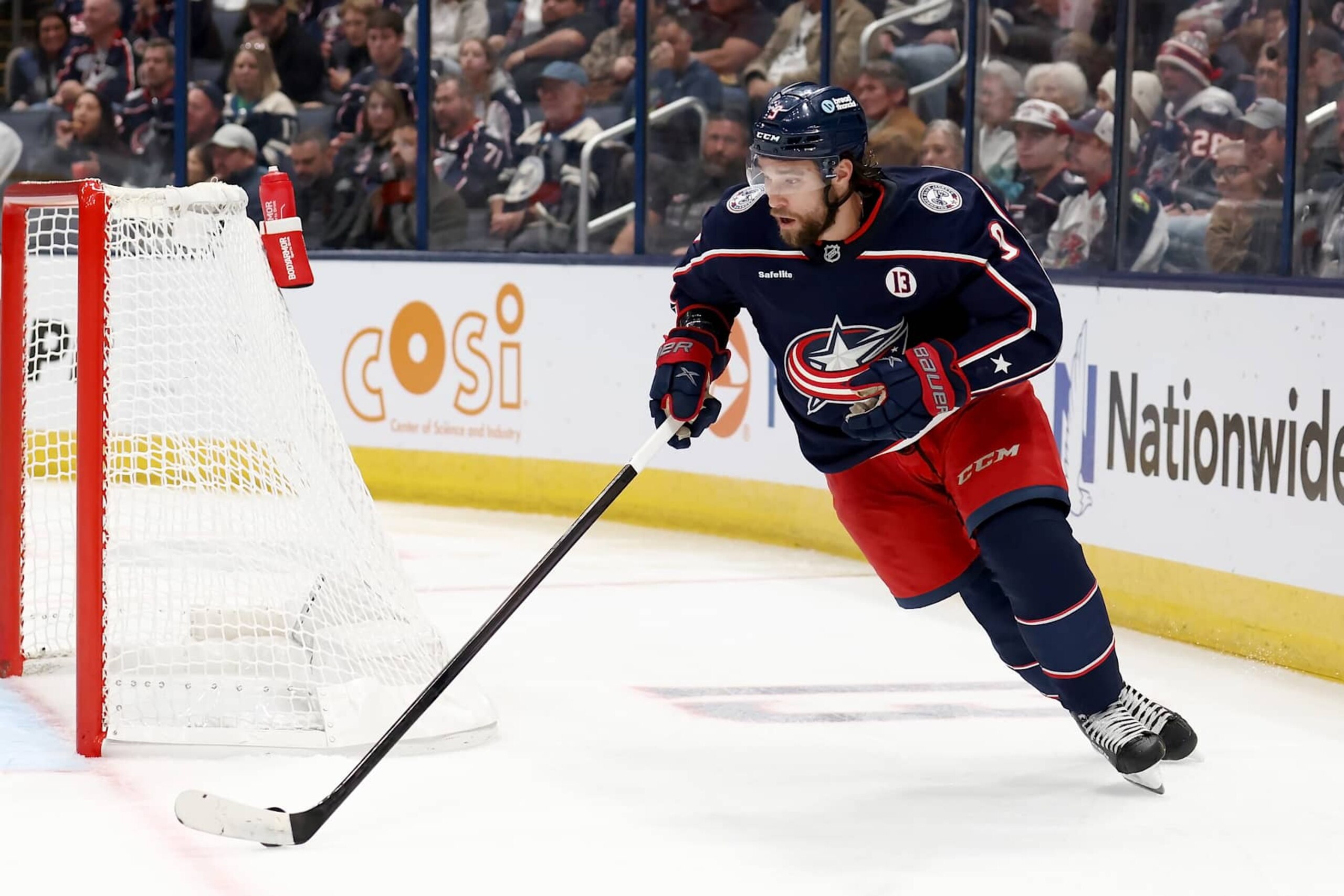 COLUMBUS, OHIO - OCTOBER 19:  Ivan Provorov #9 of the Columbus Blue Jackets skates the puck out from behind the net during the second period of the game against the Minnesota Wild at Nationwide Arena on October 19, 2024 in Columbus, Ohio. (Photo by Kirk Irwin/NHLI via Getty Images)