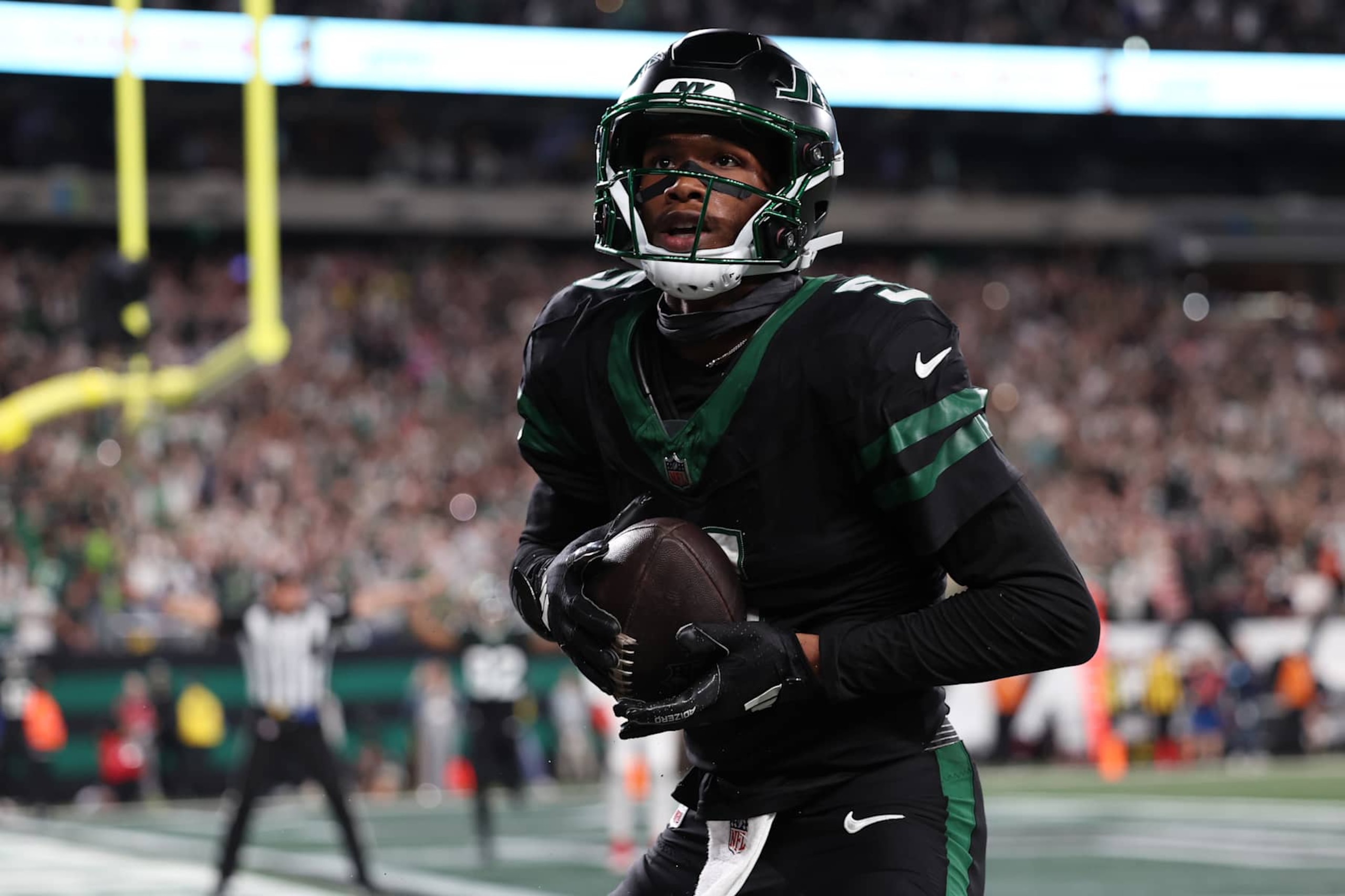 EAST RUTHERFORD, NEW JERSEY - OCTOBER 31: Garrett Wilson #5 of the New York Jets celebrates a touchdown during the fourth quarter against the Houston Texans at MetLife Stadium on October 31, 2024 in East Rutherford, New Jersey. (Photo by Luke Hales/Getty Images)