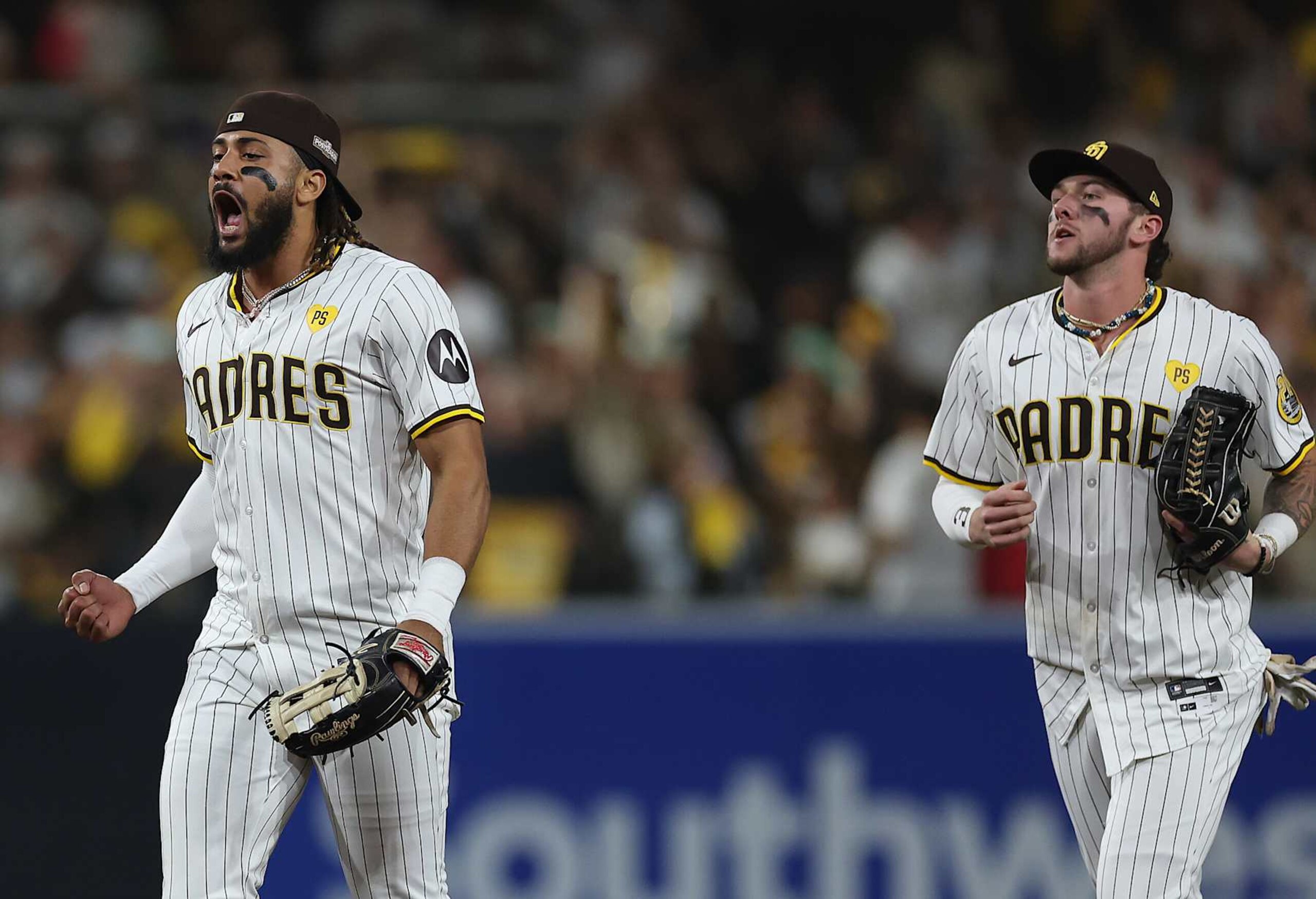 SAN DIEGO, CALIFORNIA - OCTOBER 08: Fernando Tatis Jr. #23 and Jackson Merrill #3 of the San Diego Padres celebrate after beating the Los Angeles Dodgers 6-5 in Game Three of the Division Series at Petco Park on October 08, 2024 in San Diego, California. (Photo by Sean M. Haffey/Getty Images)