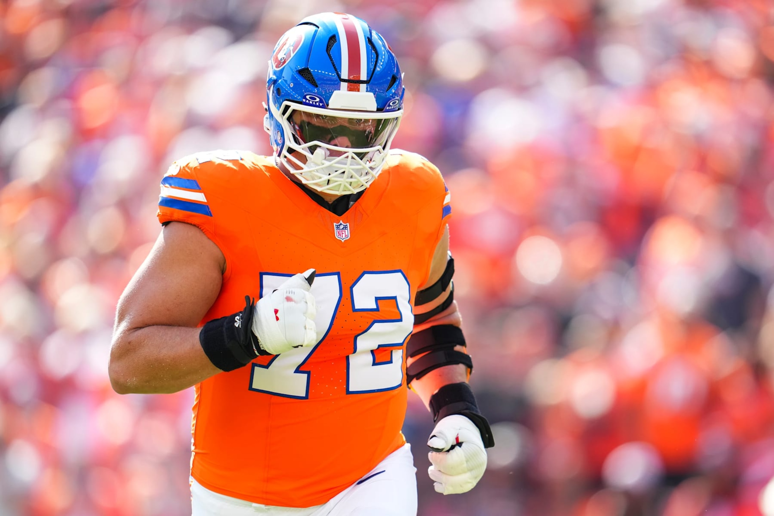 DENVER, CO - OCTOBER 06: Garett Bolles #72 of the Denver Broncos runs out of the tunnel prior to an NFL football game against the Las Vegas Raiders at Empower Field at Mile High on October 6, 2024 in Denver, Colorado. (Photo by Cooper Neill/Getty Images)