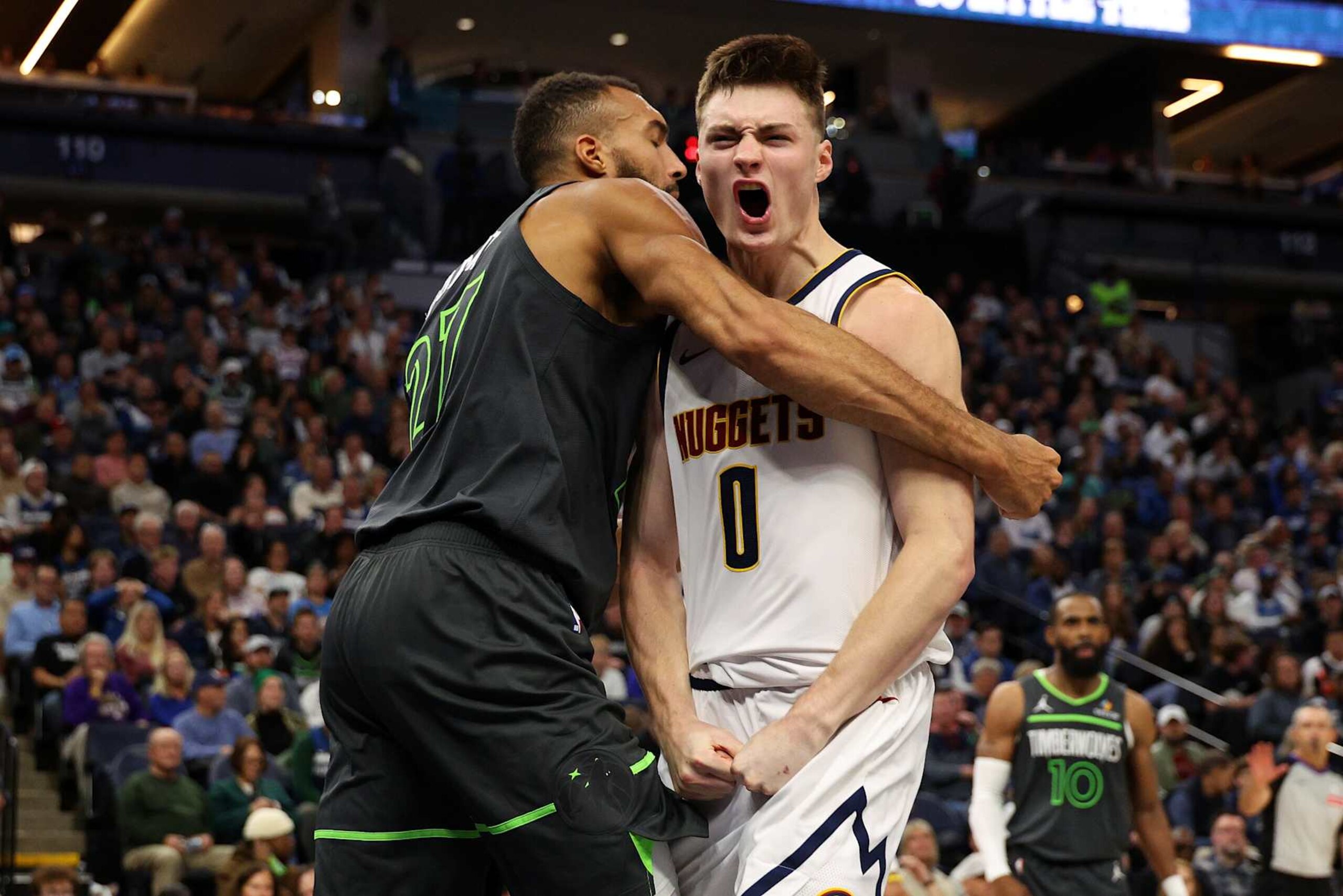 MINNEAPOLIS, MINNESOTA - NOVEMBER 01: Rudy Gobert #27 of the Minnesota Timberwolves and Christian Braun #0 of the Denver Nuggets get into a scrum in the fourth quarter. Gobert and Braun received technical fouls at Target Center on November 01, 2024 in Minneapolis, Minnesota. The Timberwolves defeated the Nuggets 119-116. NOTE TO USER: User expressly acknowledges and agrees that, by downloading and or using this photograph, User is consenting to the terms and conditions of the Getty Images License Agreement. (Photo by David Berding/Getty Images) MINNEAPOLIS, MINNESOTA - NOVEMBER 01: Rudy Gobert #27 of the Minnesota Timberwolves and Christian Braun #0 of the Denver Nuggets get into a scrum in the fourth quarter. Gobert and Braun received technical fouls at Target Center on November 01, 2024 in Minneapolis, Minnesota. The Timberwolves defeated the Nuggets 119-116. NOTE TO USER: User expressly acknowledges and agrees that, by downloading and or using this photograph, User is consenting to the terms and conditions of the Getty Images License Agreement. (Photo by David Berding/Getty Images)