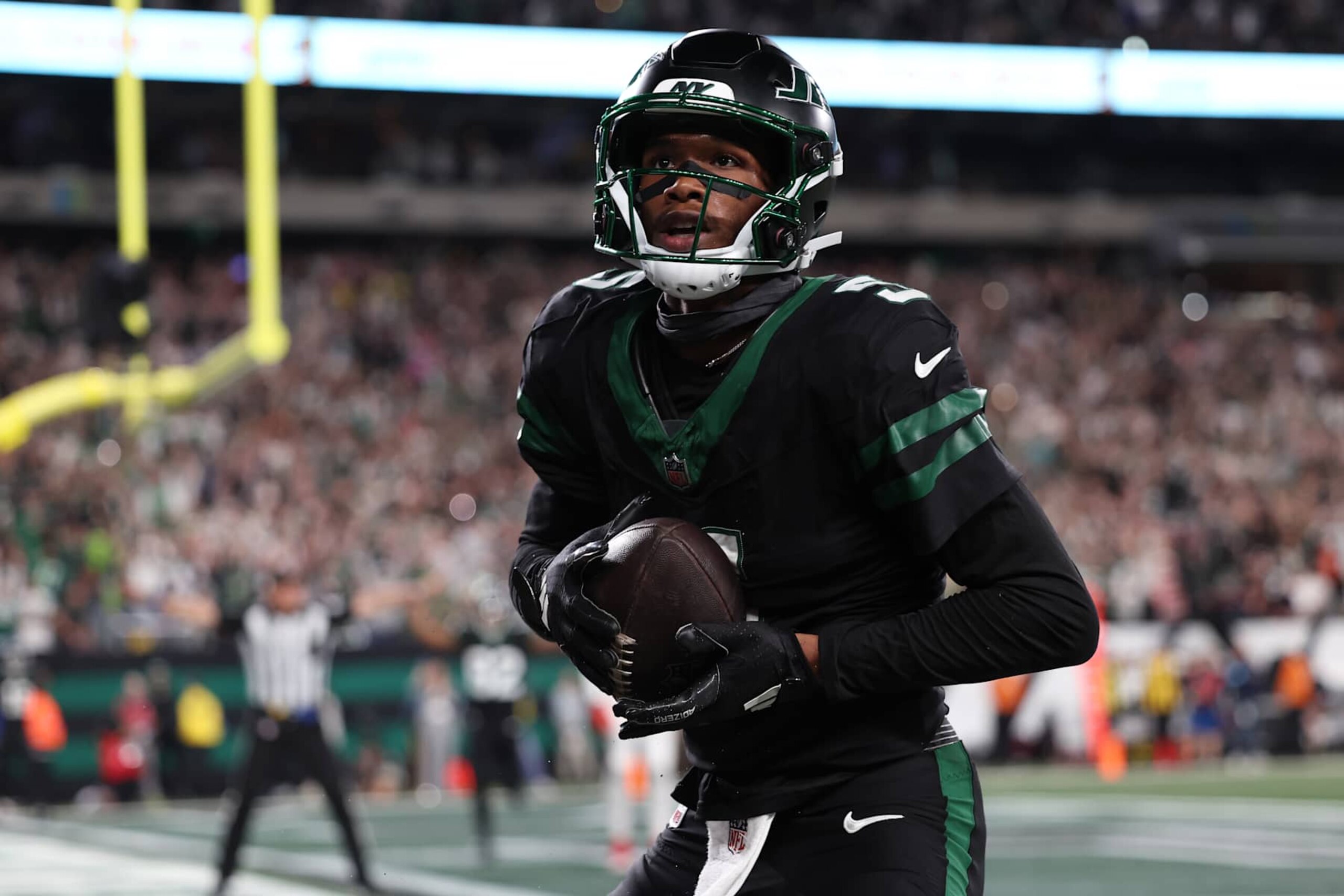 EAST RUTHERFORD, NEW JERSEY - OCTOBER 31: Garrett Wilson #5 of the New York Jets celebrates a touchdown during the fourth quarter against the Houston Texans at MetLife Stadium on October 31, 2024 in East Rutherford, New Jersey. (Photo by Luke Hales/Getty Images)