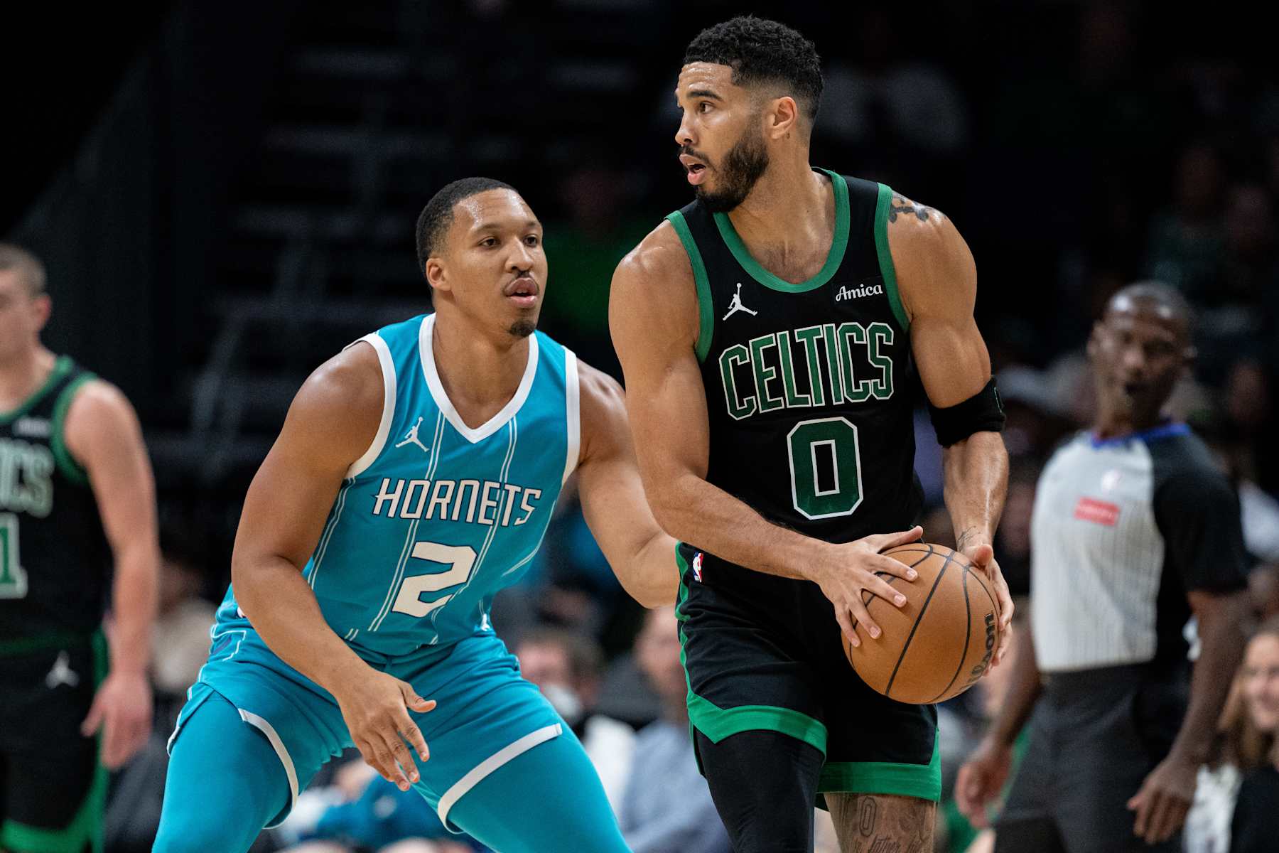 CHARLOTTE, NORTH CAROLINA - NOVEMBER 01: Grant Williams #2 of the Charlotte Hornets guards Jayson Tatum #0 of the Boston Celtics in the first quarter during their game at Spectrum Center on November 01, 2024 in Charlotte, North Carolina. NOTE TO USER: User expressly acknowledges and agrees that, by downloading and or using this photograph, User is consenting to the terms and conditions of the Getty Images License Agreement. (Photo by Jacob Kupferman/Getty Images)