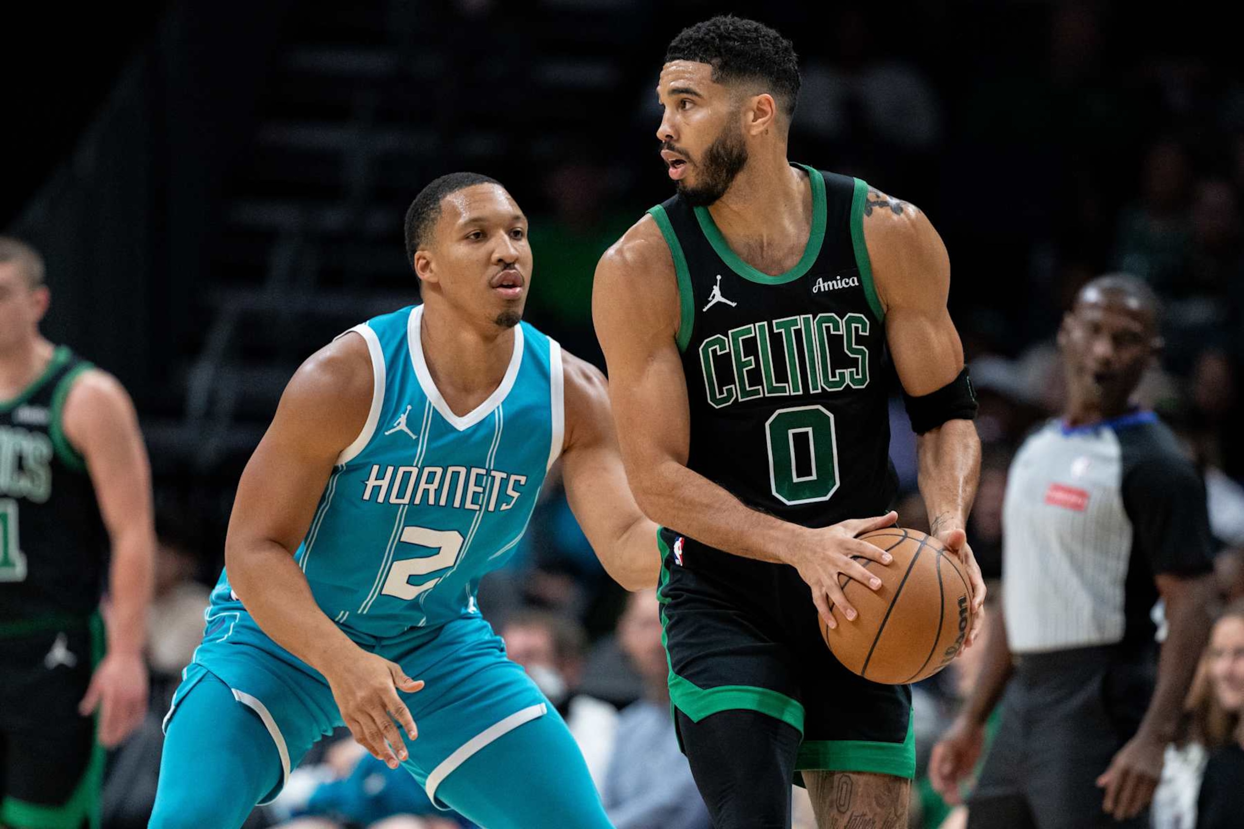 CHARLOTTE, NORTH CAROLINA - NOVEMBER 01: Grant Williams #2 of the Charlotte Hornets guards Jayson Tatum #0 of the Boston Celtics in the first quarter during their game at Spectrum Center on November 01, 2024 in Charlotte, North Carolina. NOTE TO USER: User expressly acknowledges and agrees that, by downloading and or using this photograph, User is consenting to the terms and conditions of the Getty Images License Agreement. (Photo by Jacob Kupferman/Getty Images)