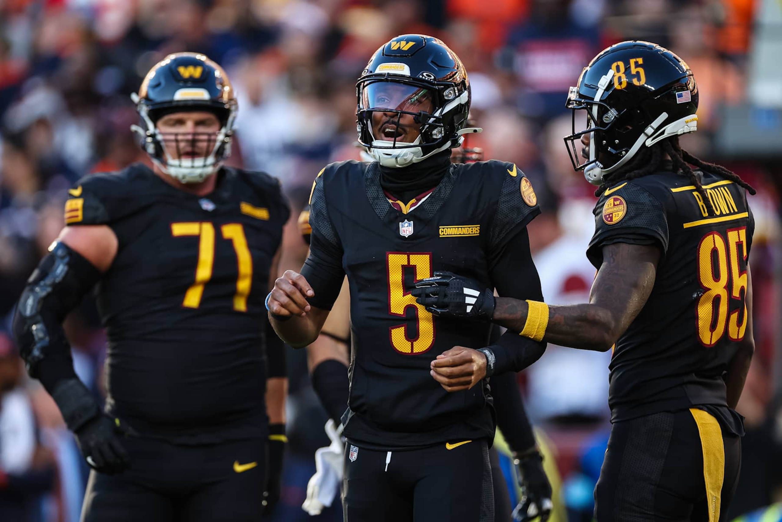 LANDOVER, MD - OCTOBER 27: Jayden Daniels #5 of the Washington Commanders reacts after a play against the Chicago Bears during the first half of the game at Northwest Stadium on October 27, 2024 in Landover, Maryland. (Photo by Scott Taetsch/Getty Images)