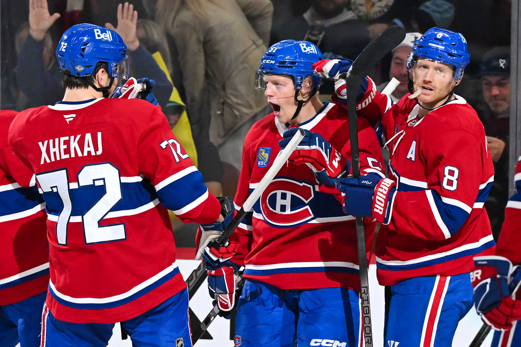 MONTREAL, CANADA - OCTOBER 14:  Emil Heineman #51 of the Montreal Canadiens celebrates his goal with teammates Arber Xhekaj #72 and Mike Matheson #8 during the second period against the Pittsburgh Penguins at the Bell Centre on October 14, 2024 in Montreal, Quebec, Canada.  The Pittsburgh Penguins defeated the Montreal Canadiens 6-3.  (Photo by Minas Panagiotakis/Getty Images)