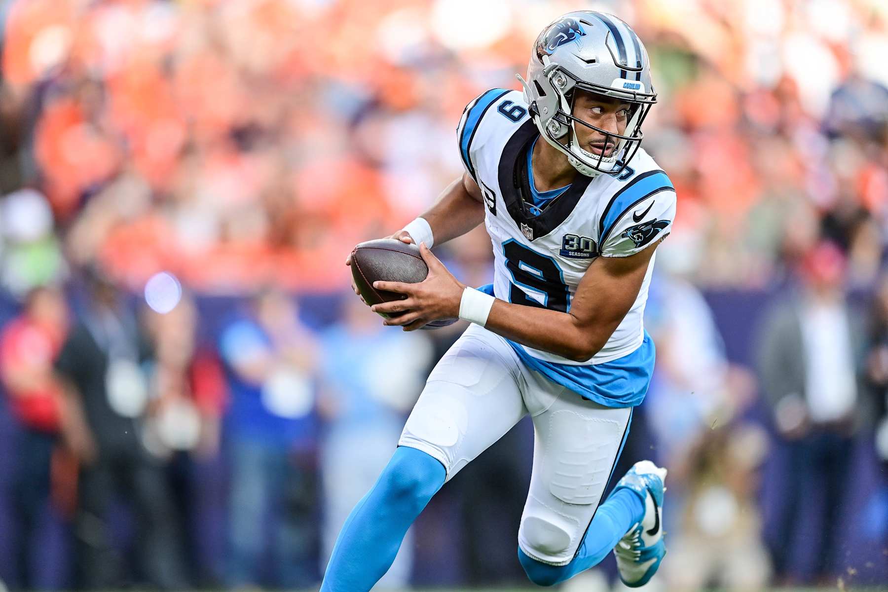 DENVER, CO - OCTOBER 27: Carolina Panthers quarterback Bryce Young (9) scrambles in the third quarter during a game between the Carolina Panthers and the Denver Broncos at Empower Field at Mile High on October 27, 2024 in Denver, Colorado. (Photo by Dustin Bradford/Icon Sportswire via Getty Images)
