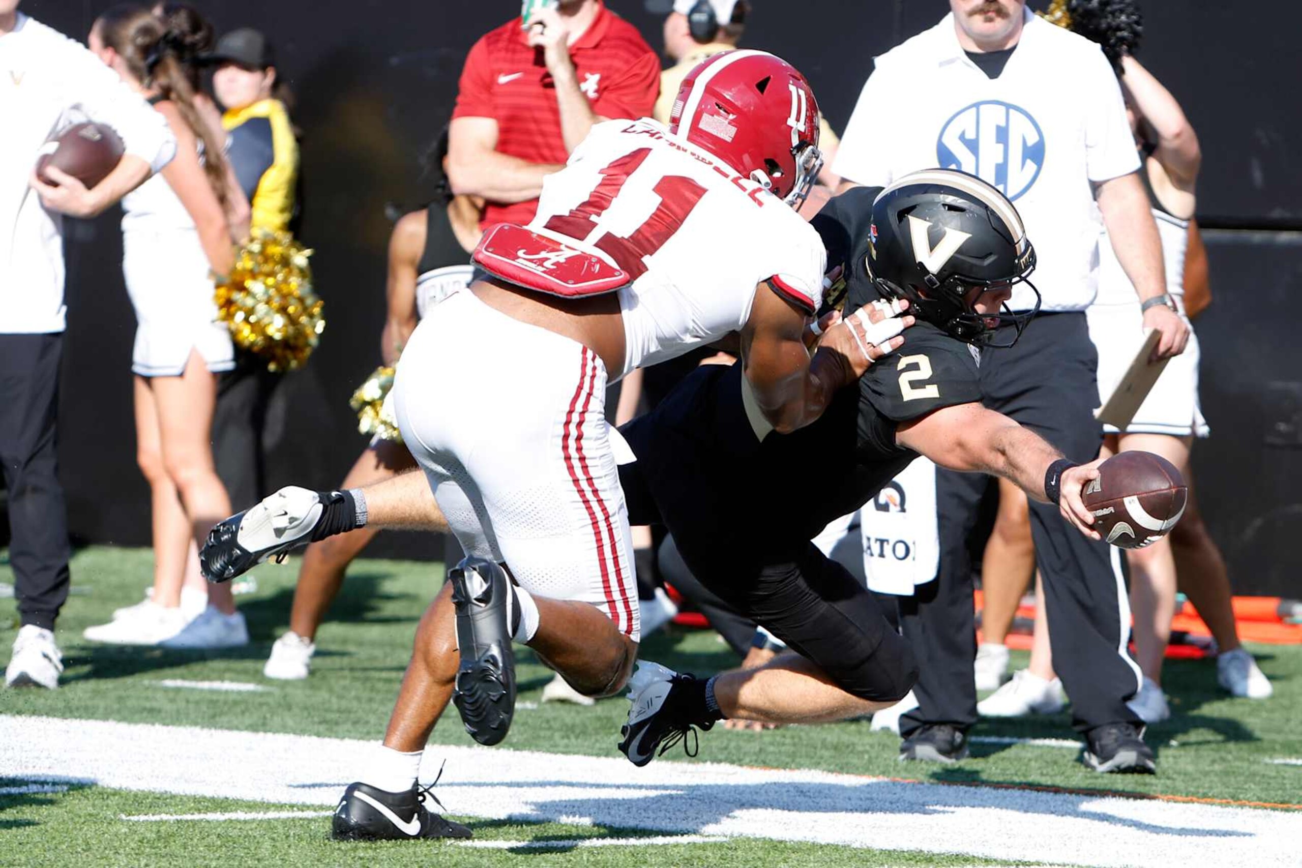 NASHVILLE, TN - OCTOBER 05: Vanderbilt Commodores quarterback Diego Pavia (2) stretches for a first down in front of Alabama Crimson Tide linebacker Jihaad Campbell (11) during a game between the Vanderbilt Commodores and Alabama Crimson Tide, October 5, 2024 at FirstBank Stadium in Nashville, Tennessee. (Photo by Matthew Maxey/Icon Sportswire via Getty Images)