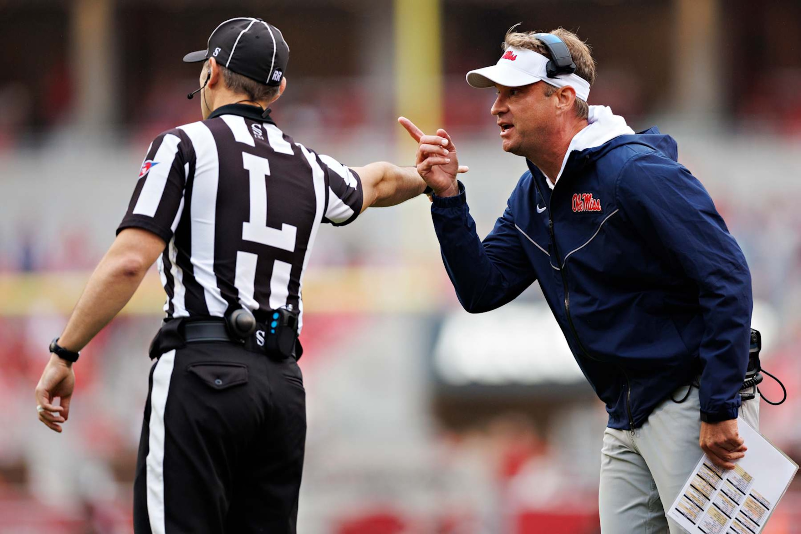 FAYETTEVILLE, ARKANSAS - NOVEMBER 02: Head Coach Lane Kiffin of the Ole Miss Rebels talks to an official in the first half of a game against the Arkansas Razorbacks at Donald W. Reynolds Razorback Stadium on November 02, 2024 in Fayetteville, Arkansas. (Photo by Wesley Hitt/Getty Images)