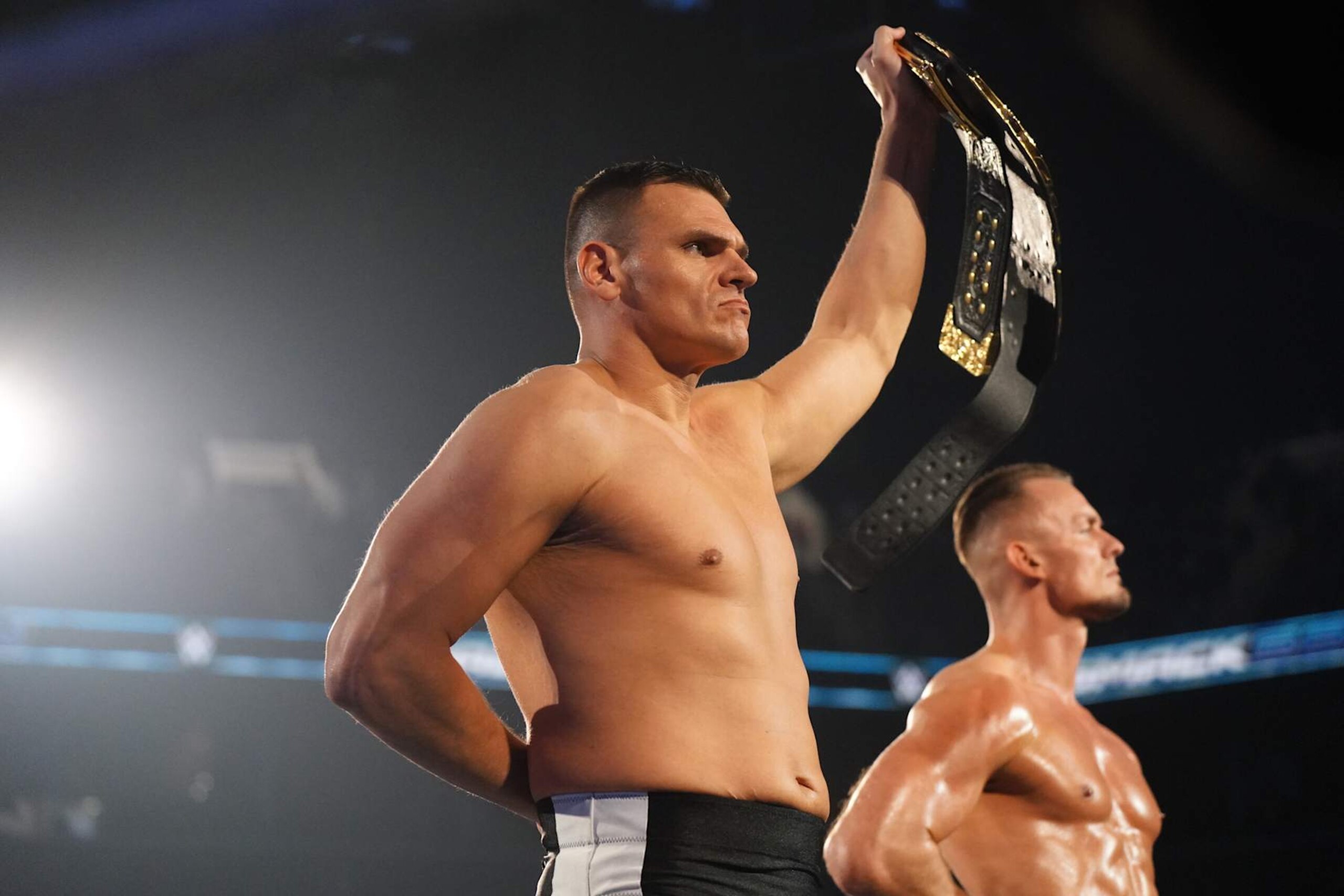 NEW YORK, NEW YORK - NOVEMBER 1: WWE World Heavyweight Champion GUNTHER holds up his title as he makes his entrance to the ring with Ludwig Kaiser during WWE SmackDown at Barclays Center on November 1, 2024 in New York City.  (Photo by WWE/Getty Images)