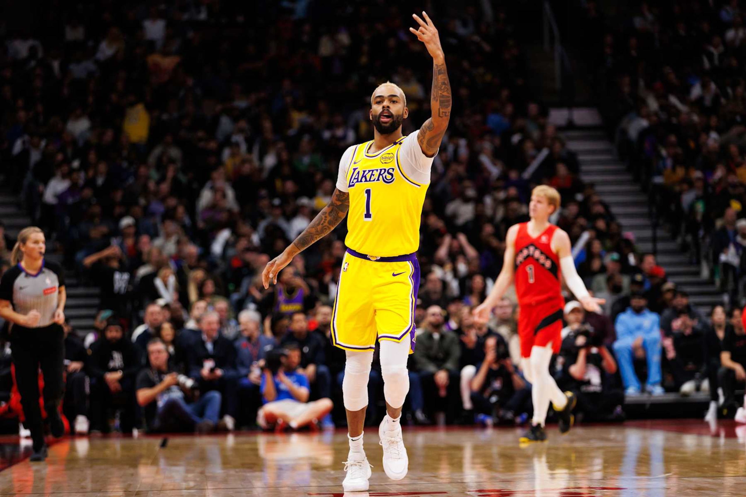TORONTO, CANADA - NOVEMBER 01: D'Angelo Russell #1 of the Los Angeles Lakers reacts after sinking a shot against the Toronto Raptors during the second half of their NBA game at Scotiabank Arena on November 1, 2024 in Toronto, Canada. NOTE TO USER: User expressly acknowledges and agrees that, by downloading and or using this photograph, User is consenting to the terms and conditions of the Getty Images License Agreement. (Photo by Cole Burston/Getty Images)