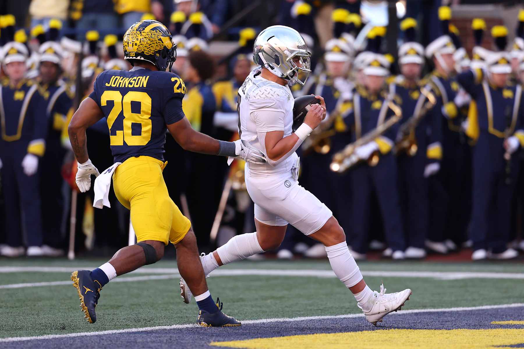 ANN ARBOR, MICHIGAN - NOVEMBER 02: Dillon Gabriel #8 of the Oregon Ducks runs the ball for a touchdown during the second quarter against the Michigan Wolverines at Michigan Stadium on November 02, 2024 in Ann Arbor, Michigan. (Photo by Gregory Shamus/Getty Images)
